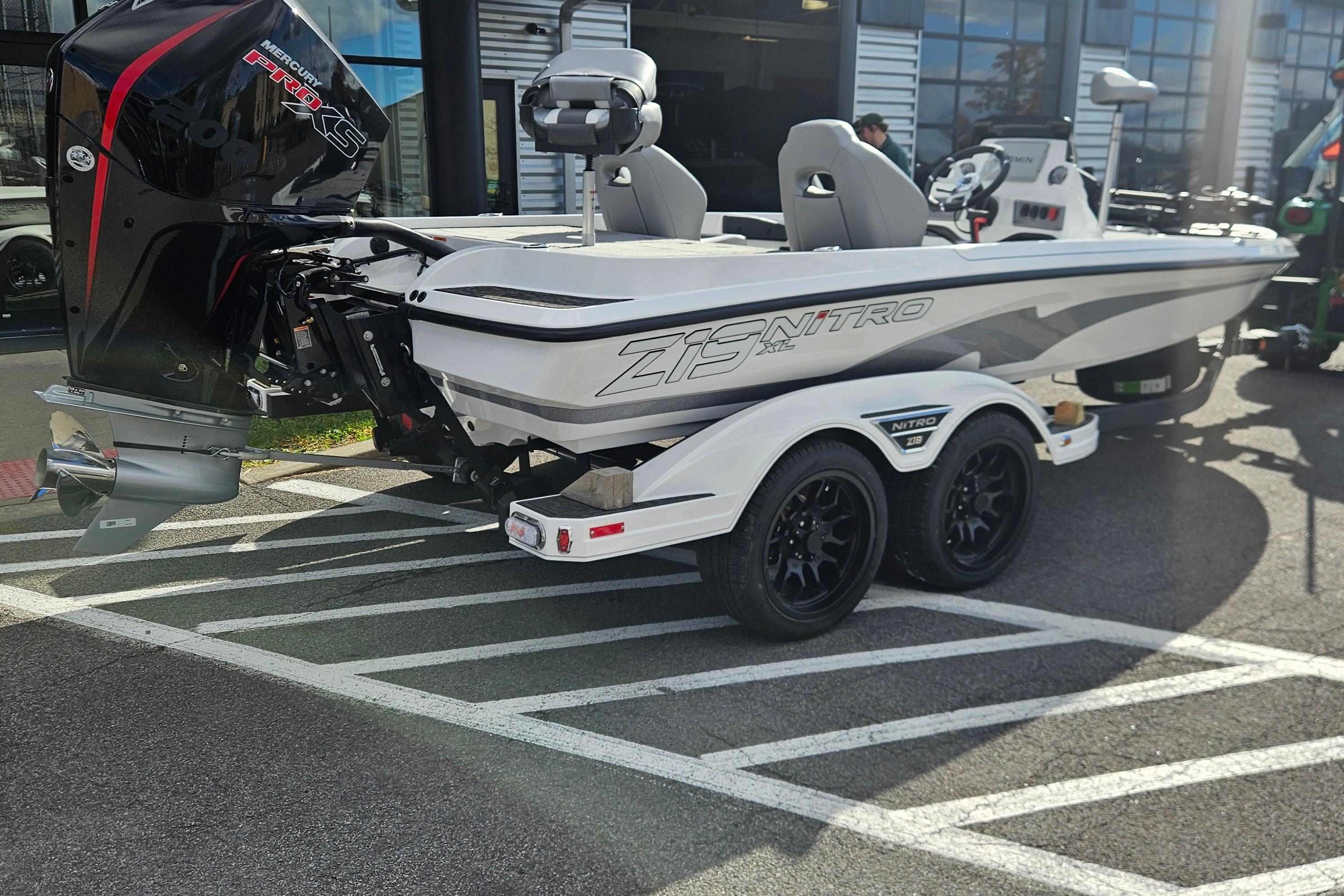 2026 Nitro Z19 XL Pro boat on trailer, parked outdoors, featuring sleek design and powerful engine.