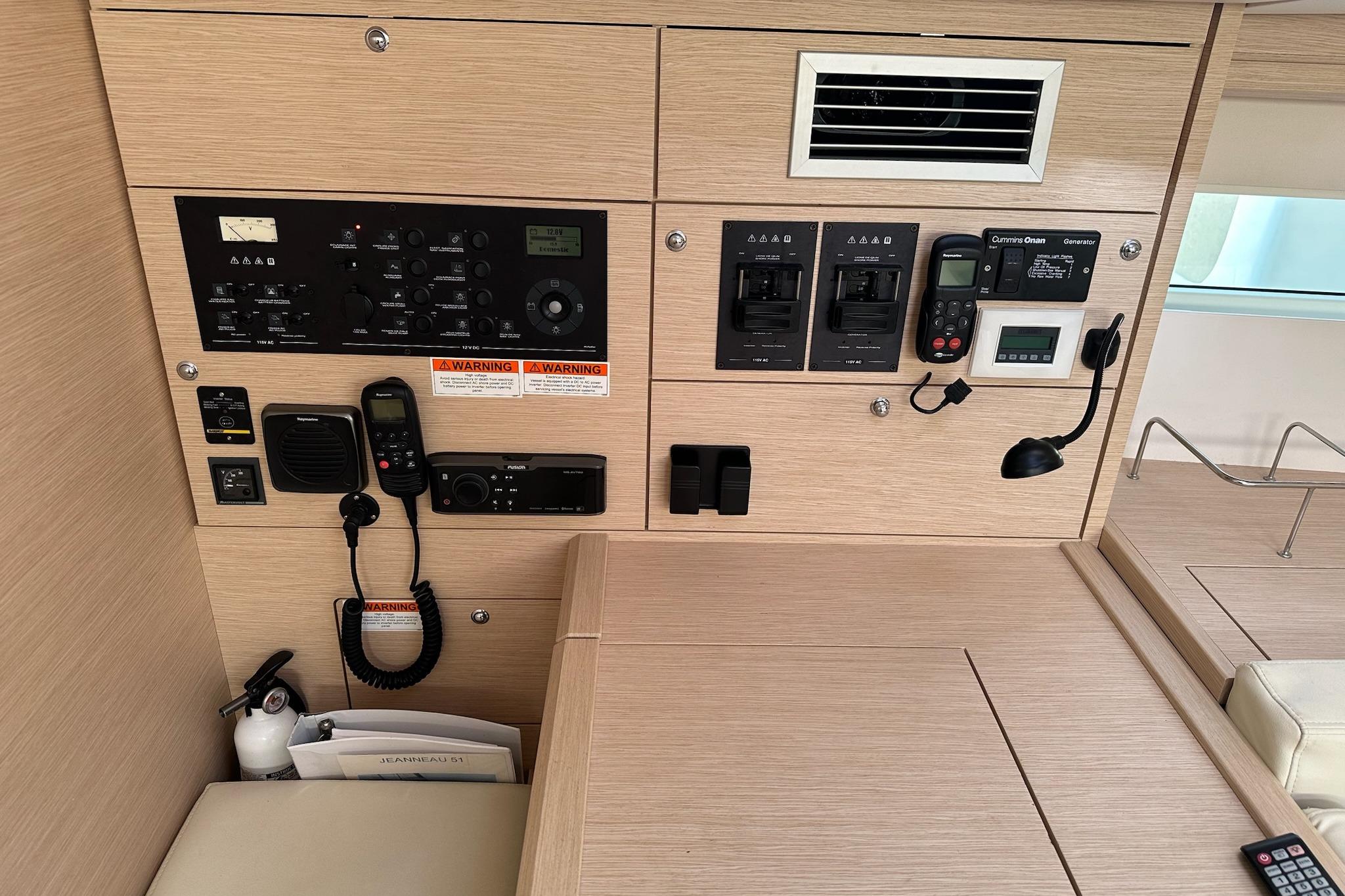 Control panel of a 2018 Jeanneau 51 yacht, featuring navigation and communication equipment.