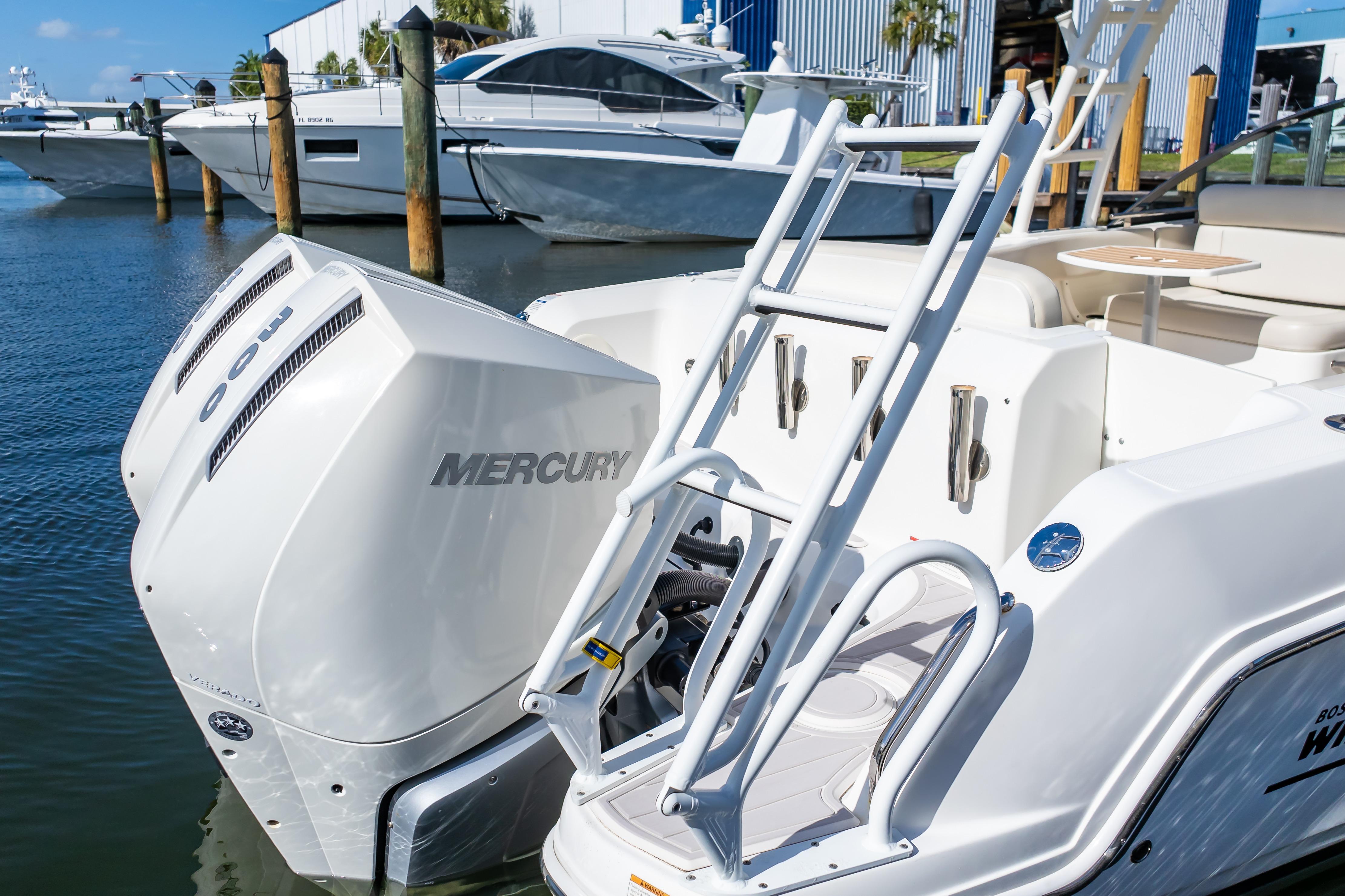 2019 Boston Whaler 270 Vantage with Mercury outboard engines docked at marina.