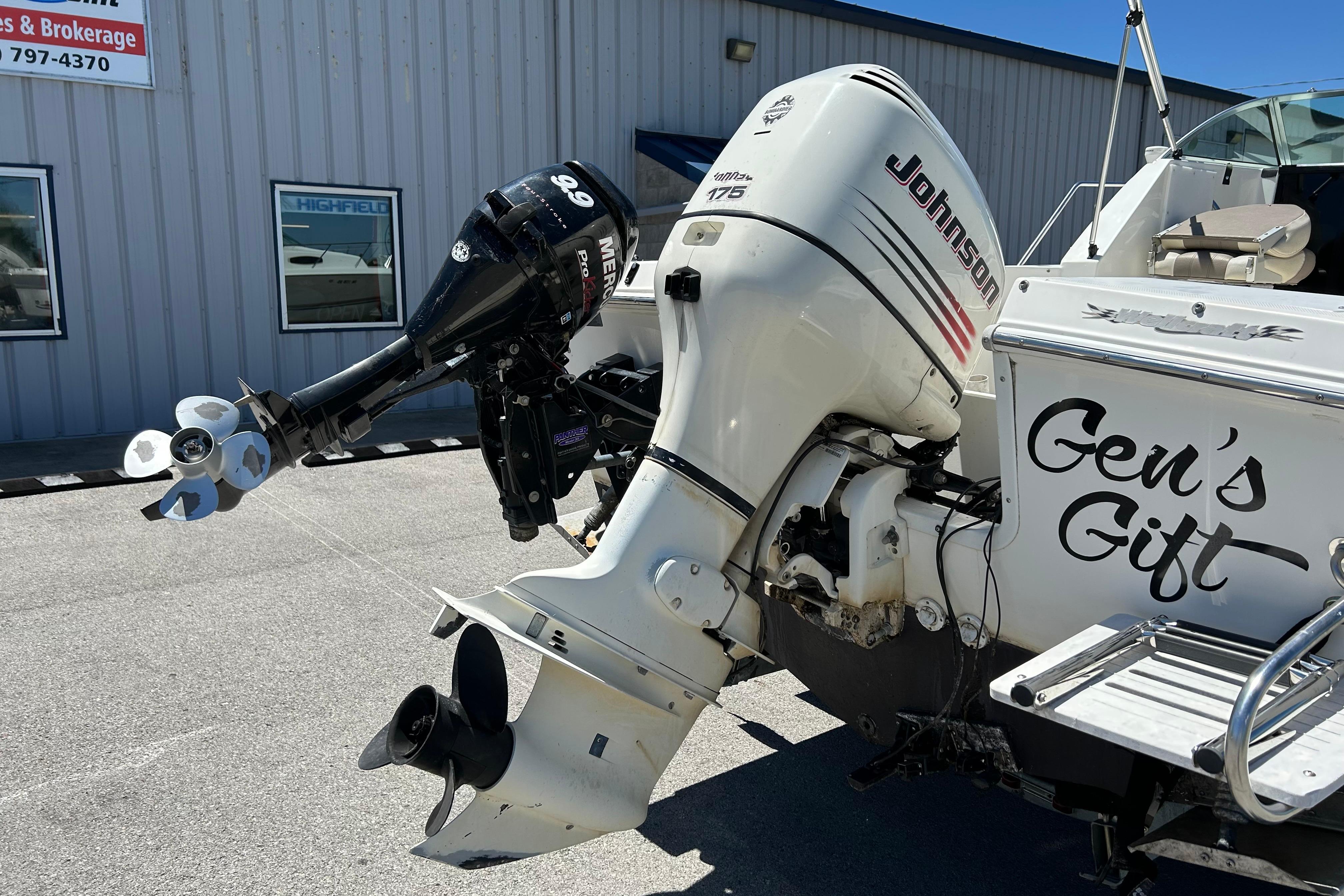 2003 Wellcraft 220 Coastal boat with Johnson and Mercury outboard motors, labeled "Gen's Gift."