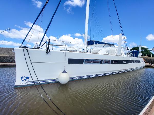 2009 Catana 65 sailboat docked in calm waters under a clear blue sky.