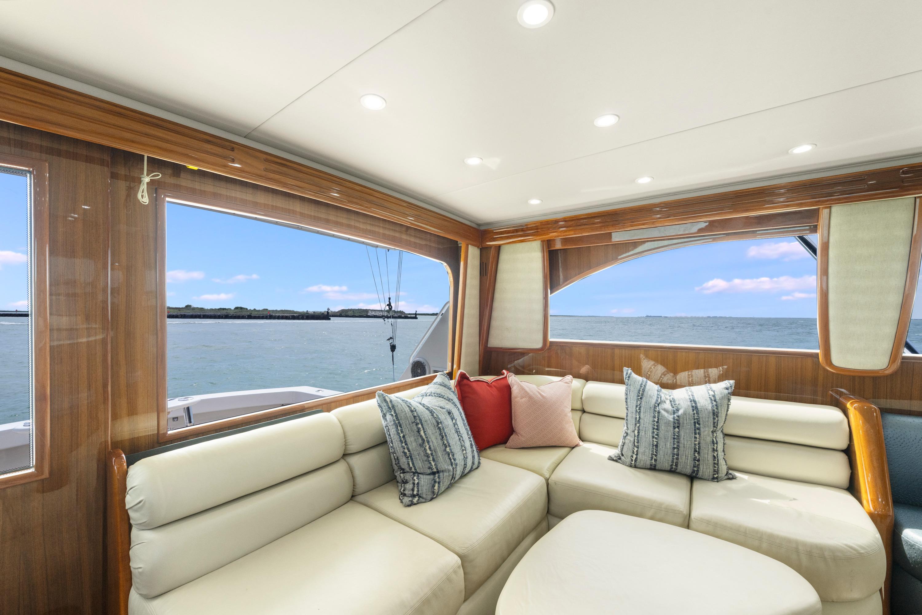 Luxurious interior of 2009 Viking 50 Convertible yacht with ocean view.