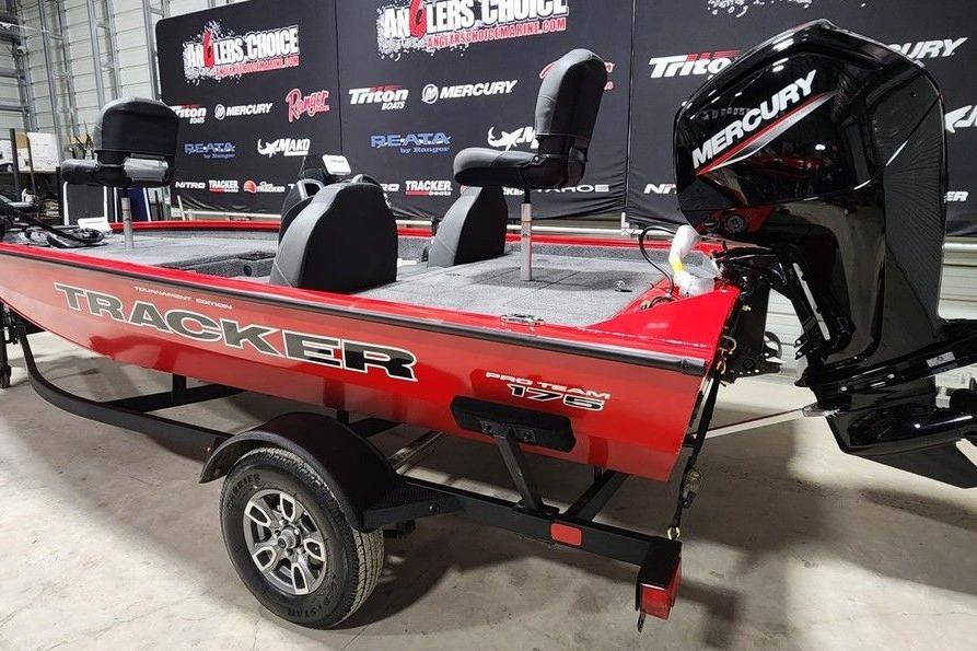 2026 Tracker Pro Team 175 boat with Mercury engine, displayed indoors.