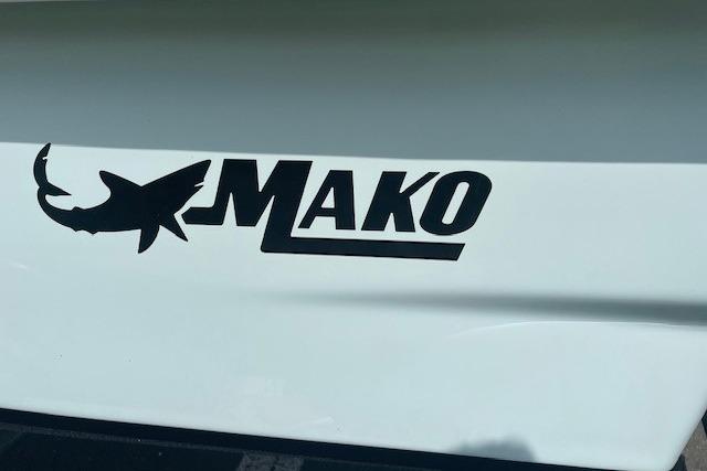 2026 Mako Pro Skiff 13 CC logo on white boat surface.