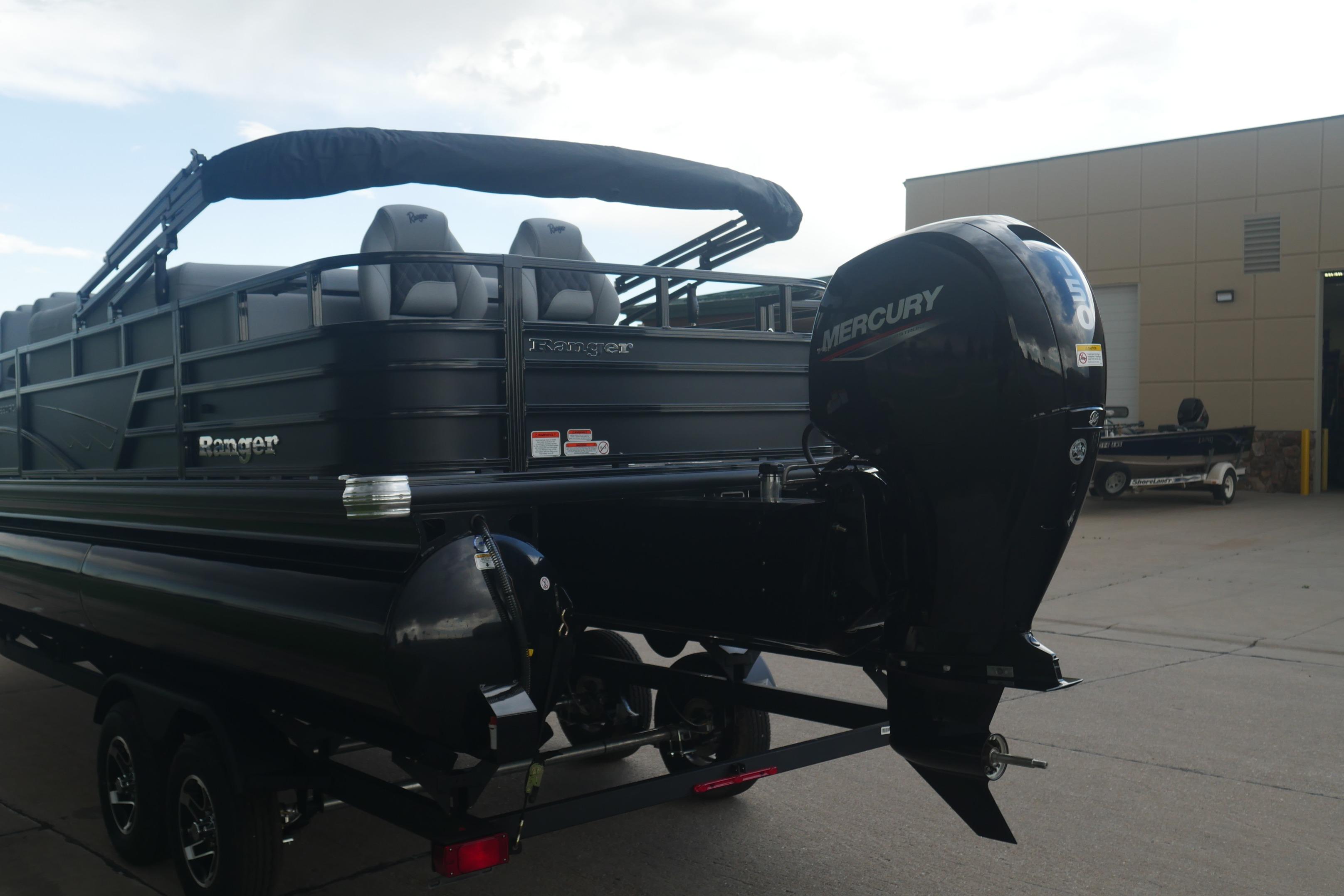 2026 Ranger 220FC pontoon boat with Mercury outboard motor, parked outdoors.