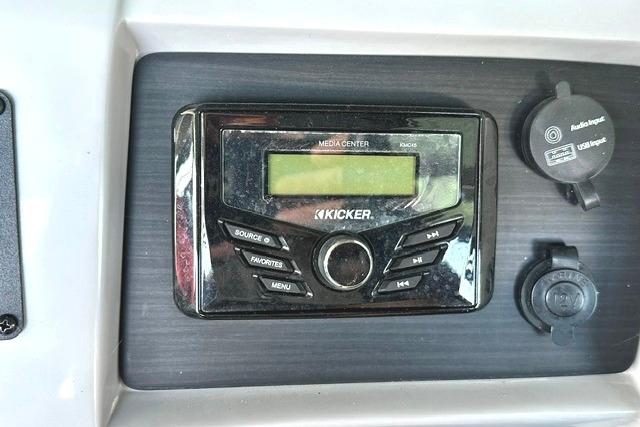 Kicker media center on 2021 Bennington L Bowrider 25 Quad Bench dashboard.