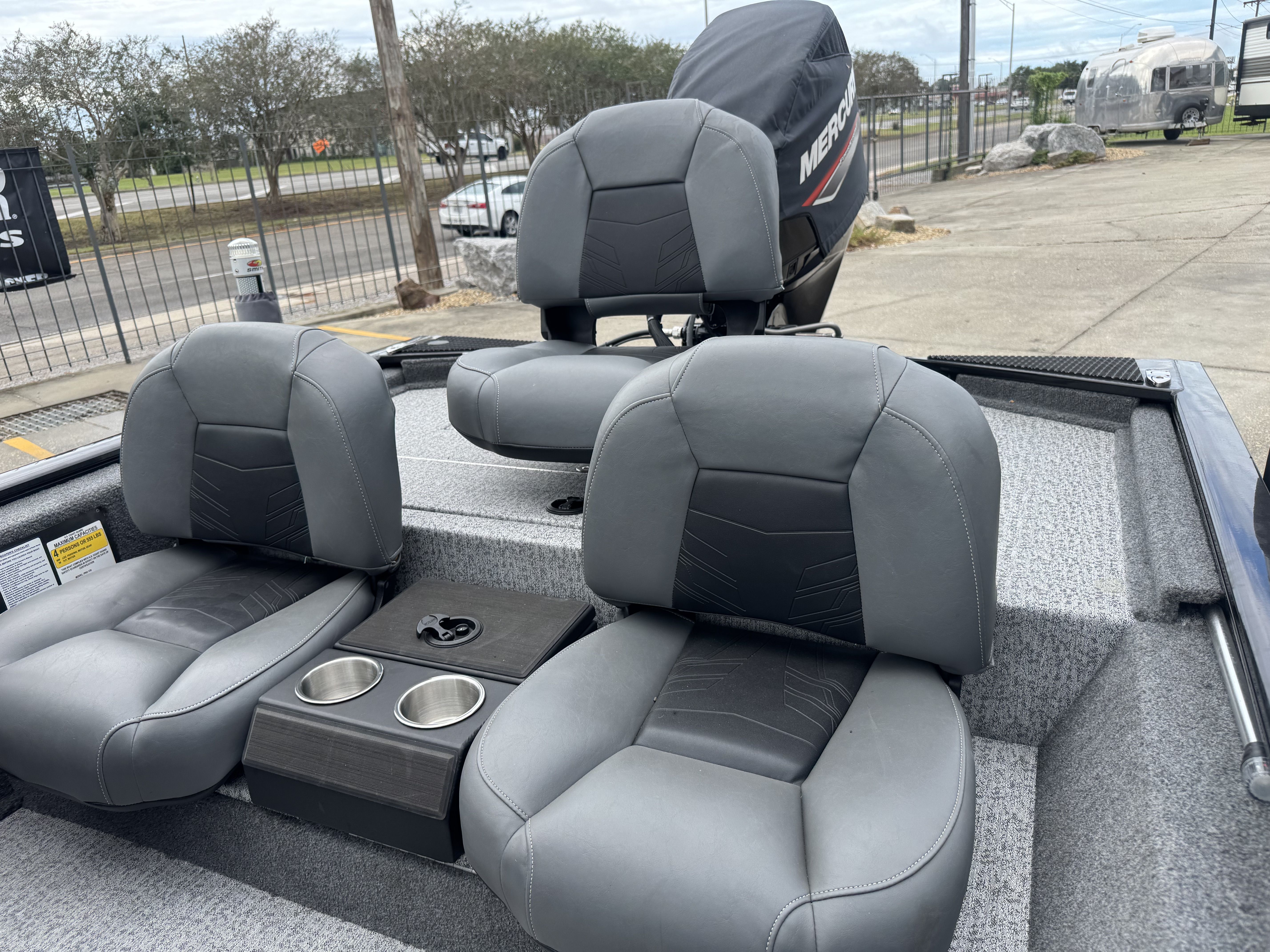 2024 Tracker Pro 170 boat interior with gray seats and cup holders.