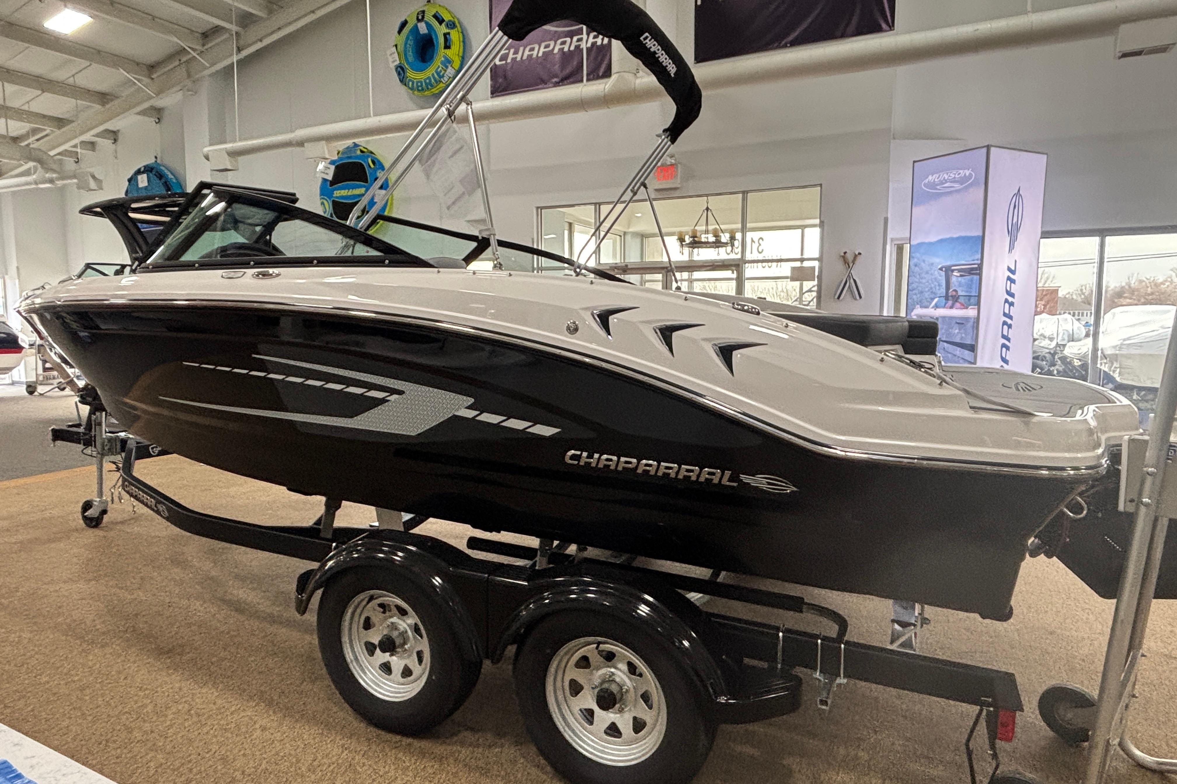 2026 Chaparral 21 SSi boat in showroom on trailer.