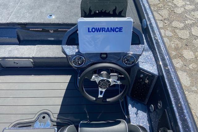 2026 Phoenix 921 ELITE boat dashboard with Lowrance display and steering wheel.
