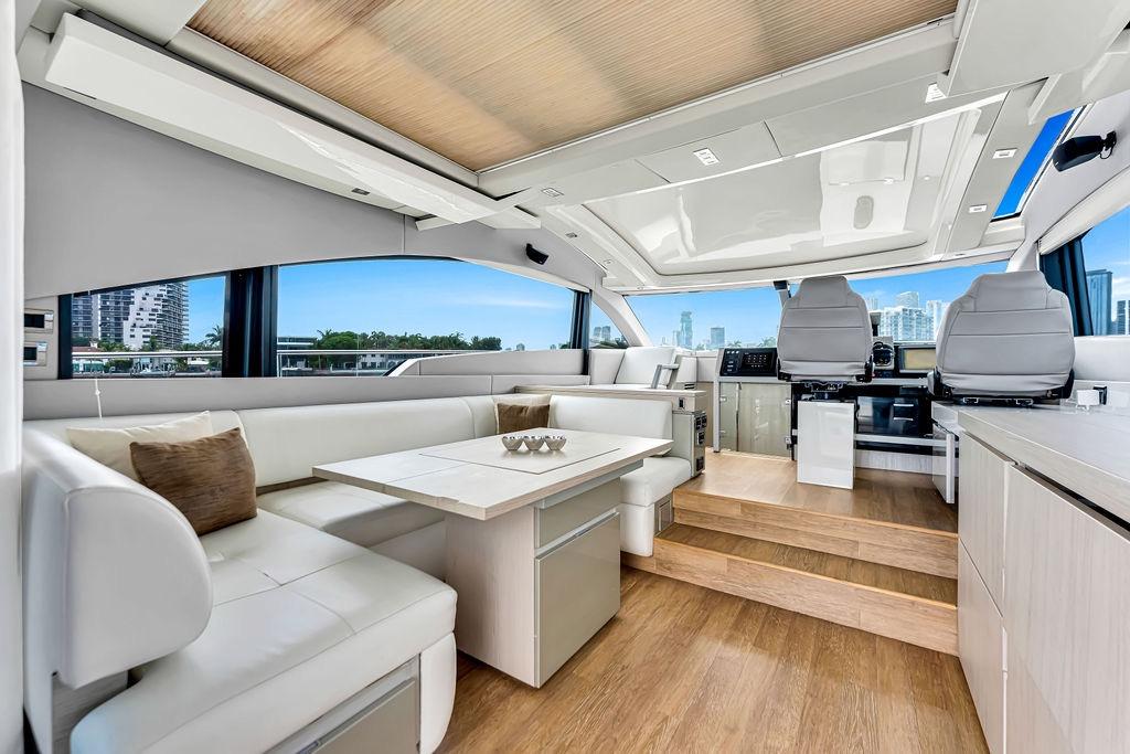 Luxurious interior of 2012 Fairline Targa 58 yacht with modern seating and panoramic windows.