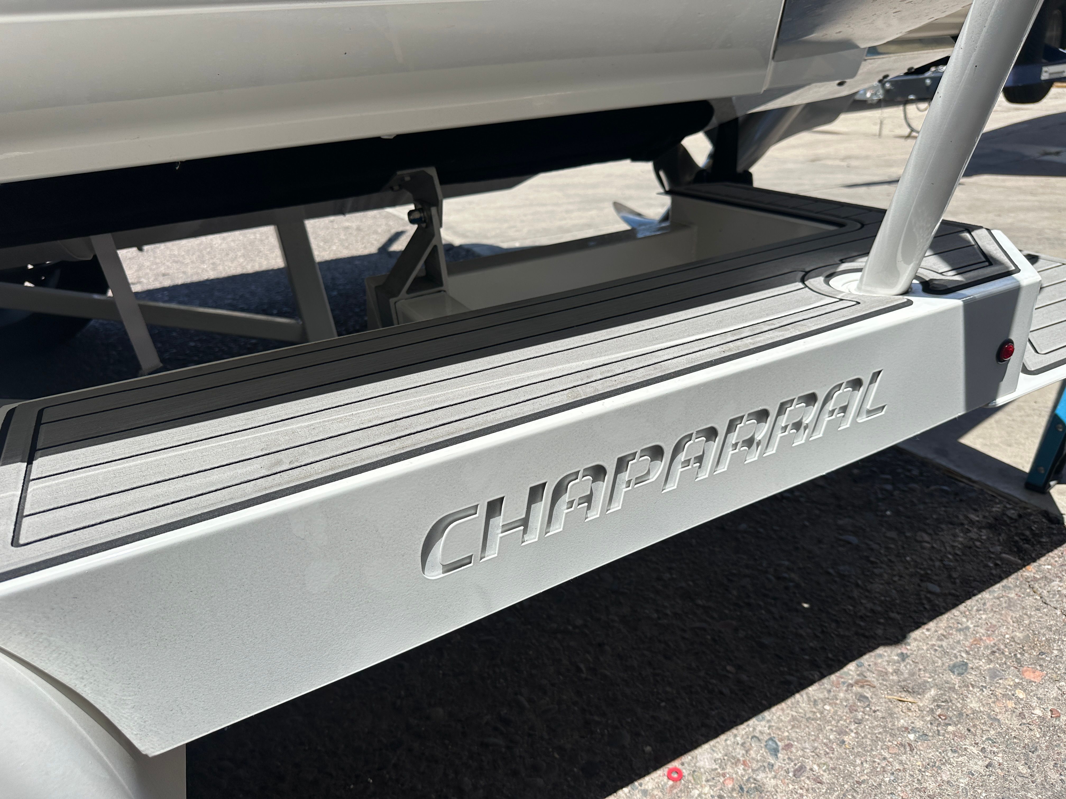 Close-up of a Chaparral 26 Surf boat on a trailer.