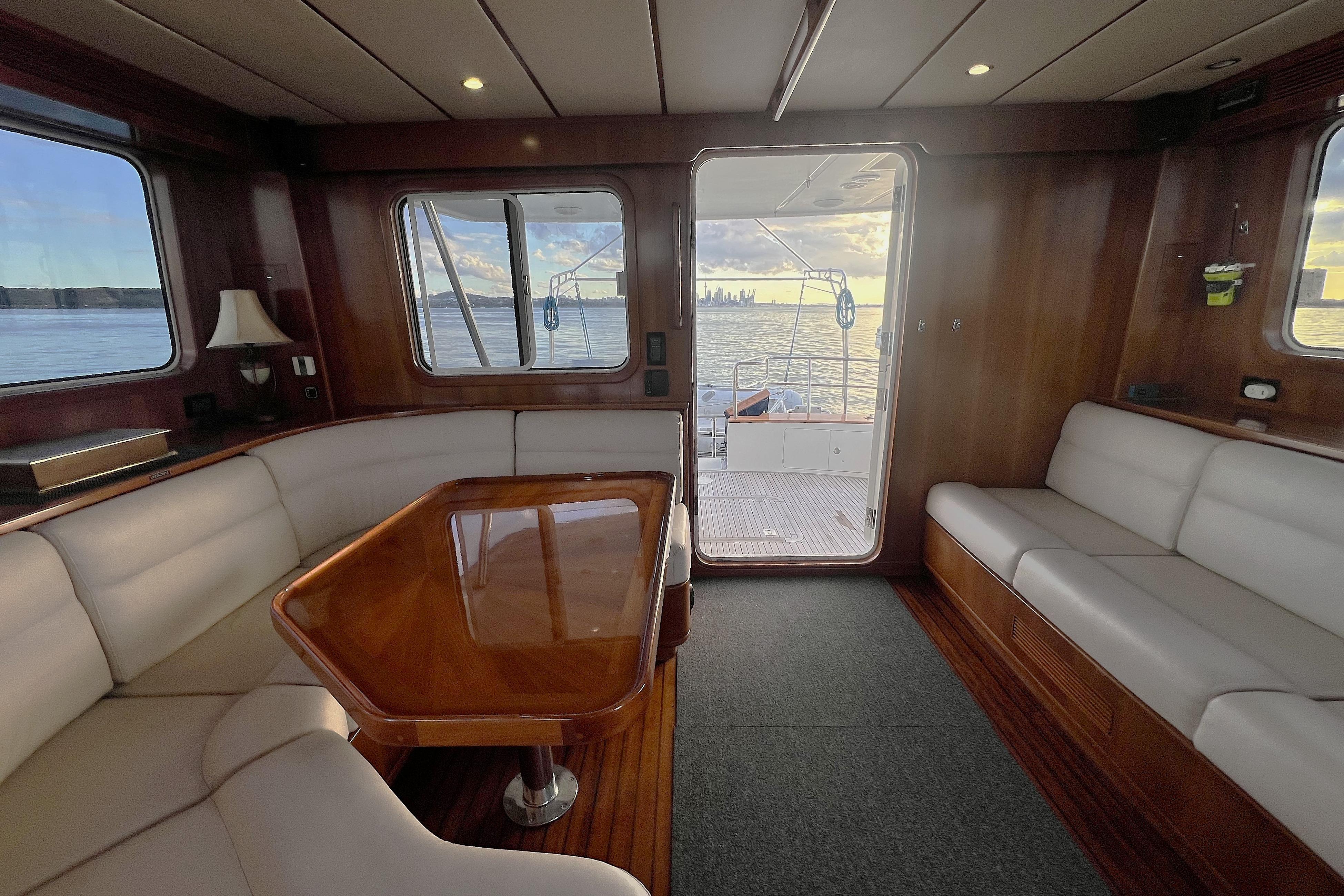 Luxurious interior of 2009 Nordhavn 56 Motorsailer with elegant seating and ocean view.