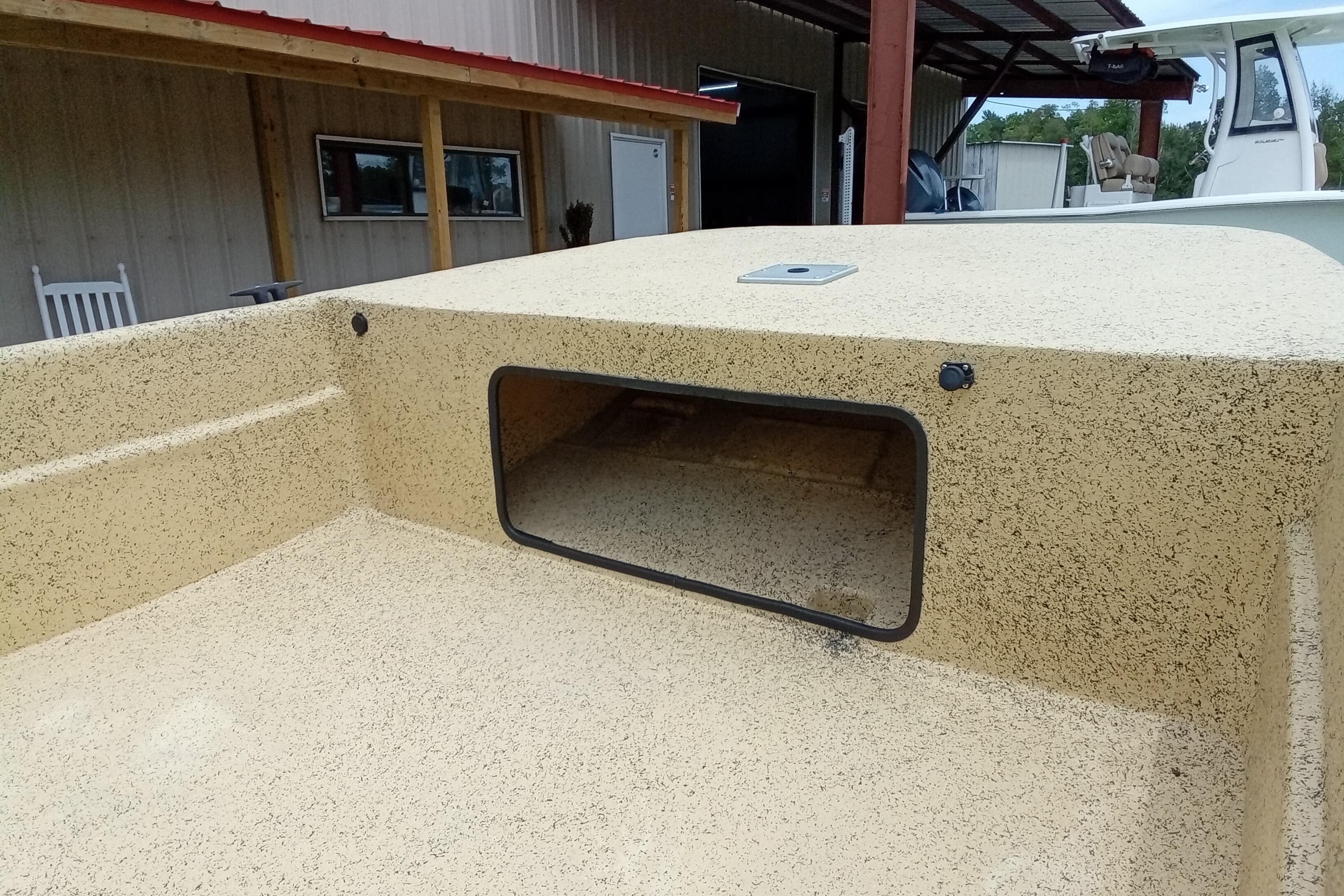 Fibercraft F17 boat deck, 2025 model, featuring a textured surface and storage compartment.