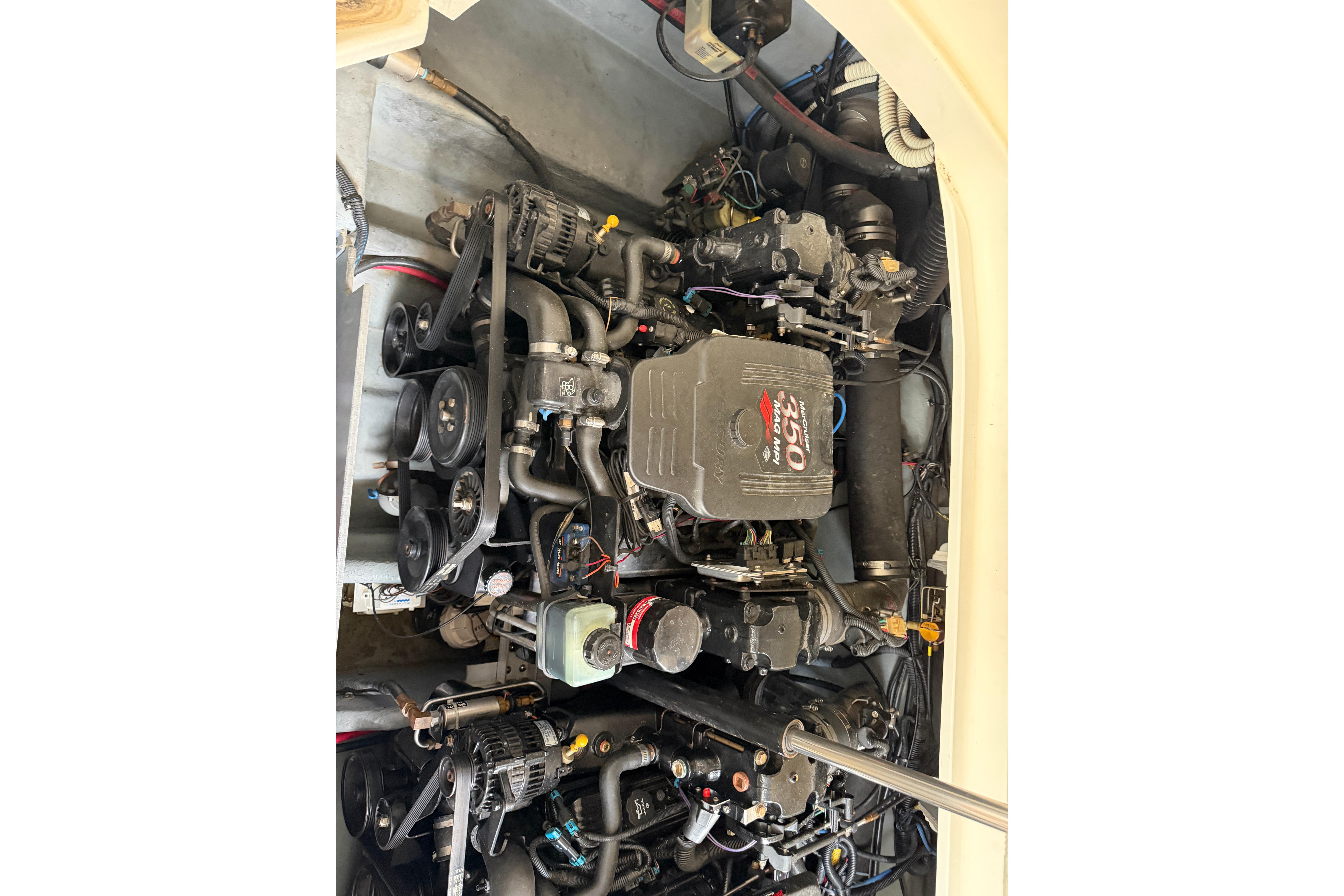 Engine compartment of a 2003 Sea Ray 290 Bowrider boat, showcasing mechanical components.