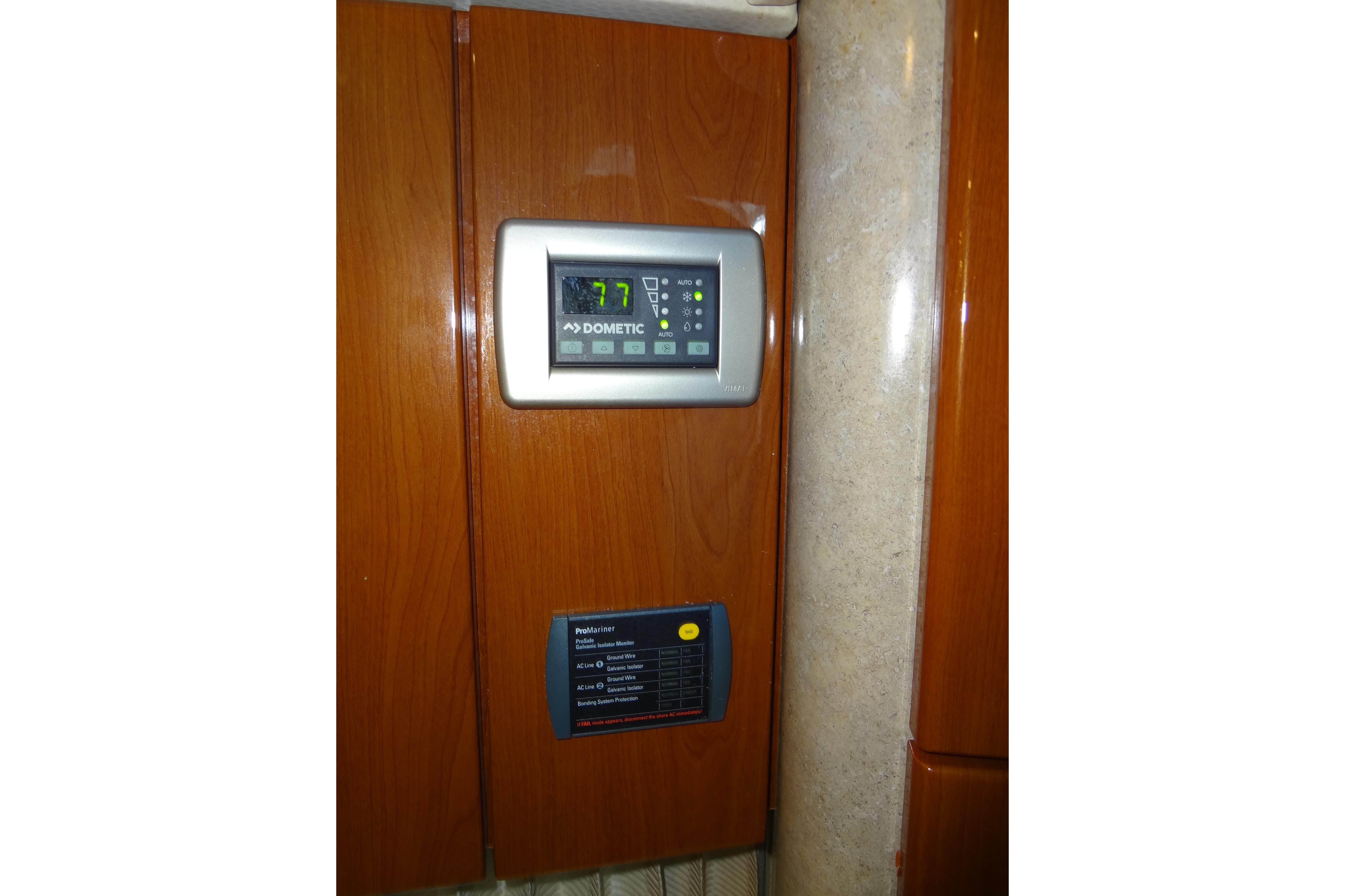 Thermostat and control panel inside 2007 Formula 34 Performance Cruiser yacht.