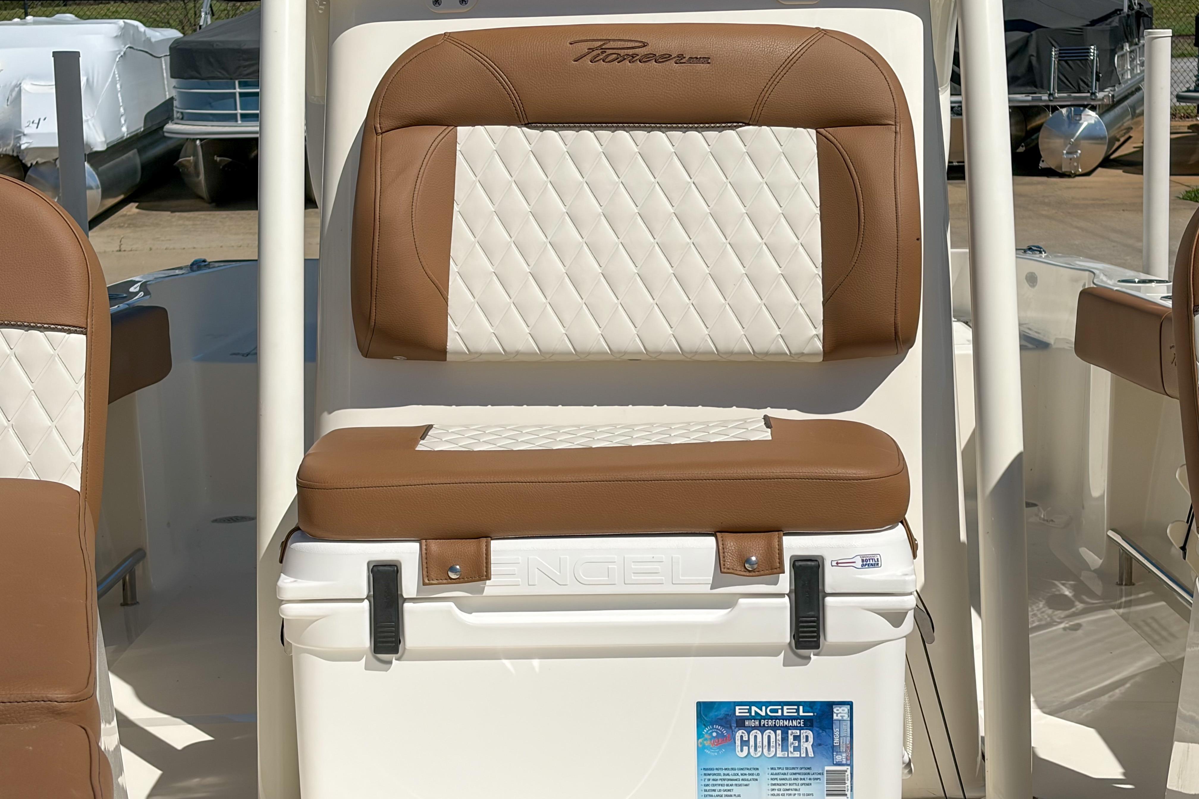 2026 Pioneer 220 Bay Sport boat seat with Engel cooler, featuring brown and white upholstery.