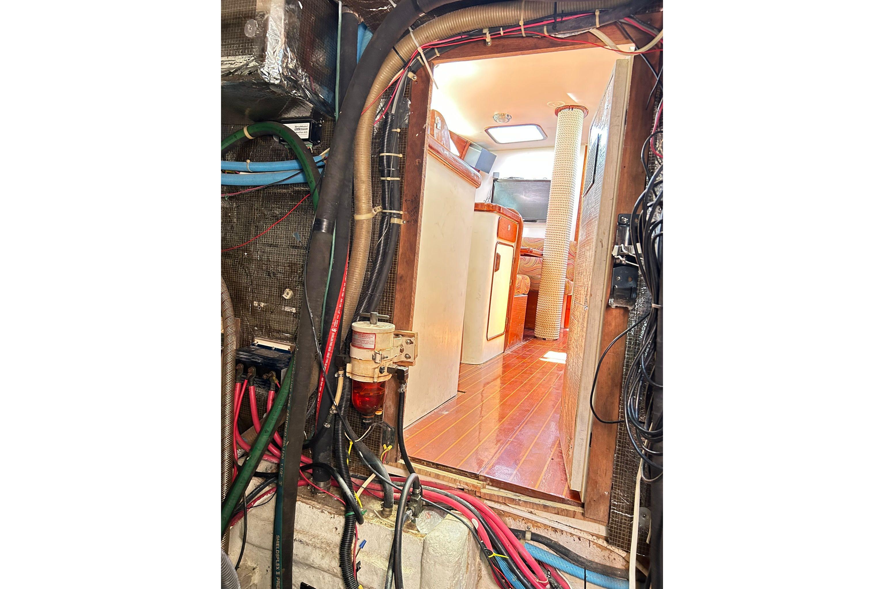Interior view of 1987 Gulfstar CSY 50 Pilot House with visible wiring and wood flooring.