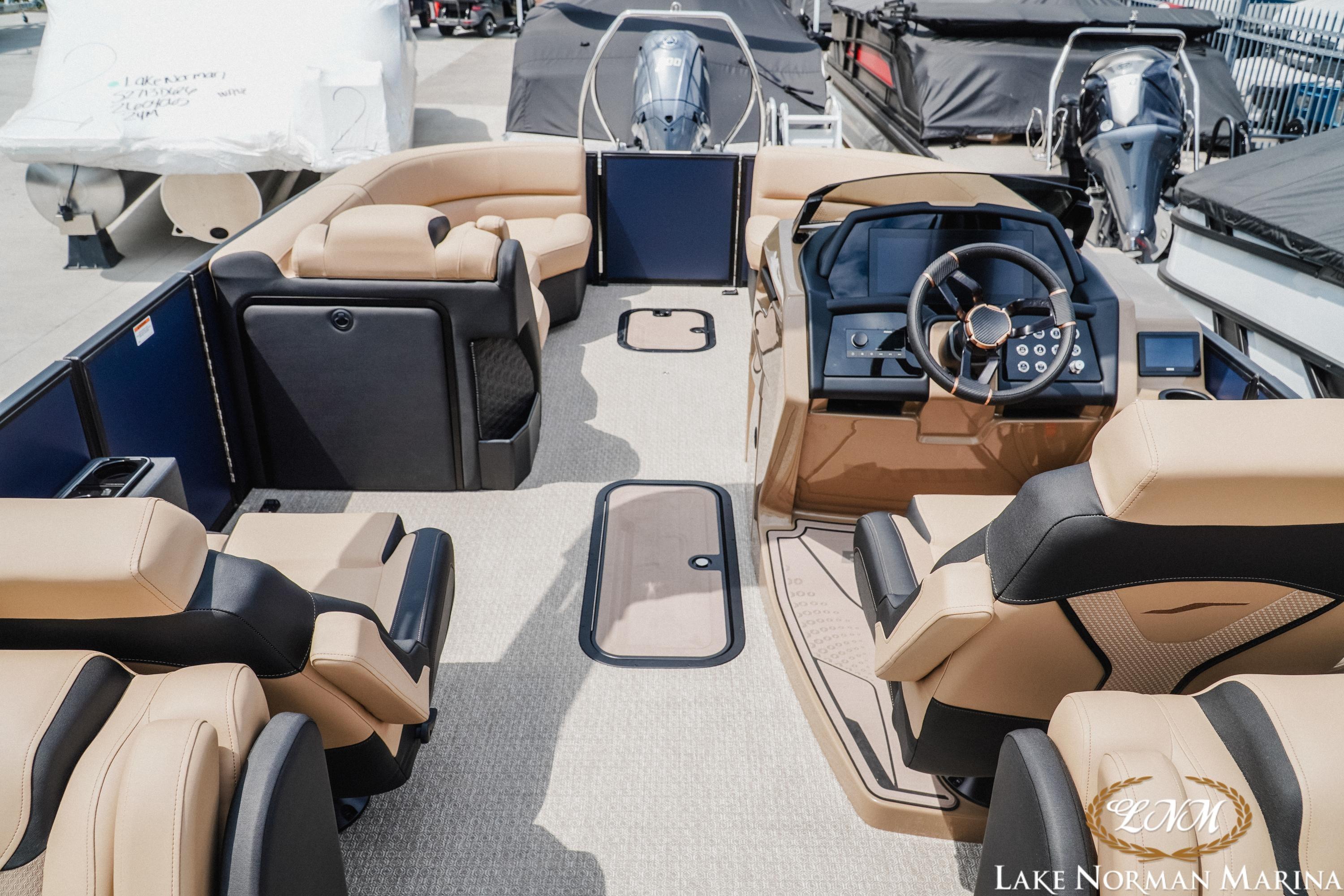 Luxurious 2026 Evotti 723QL boat interior with plush seating and modern dashboard at Lake Norman Marina.