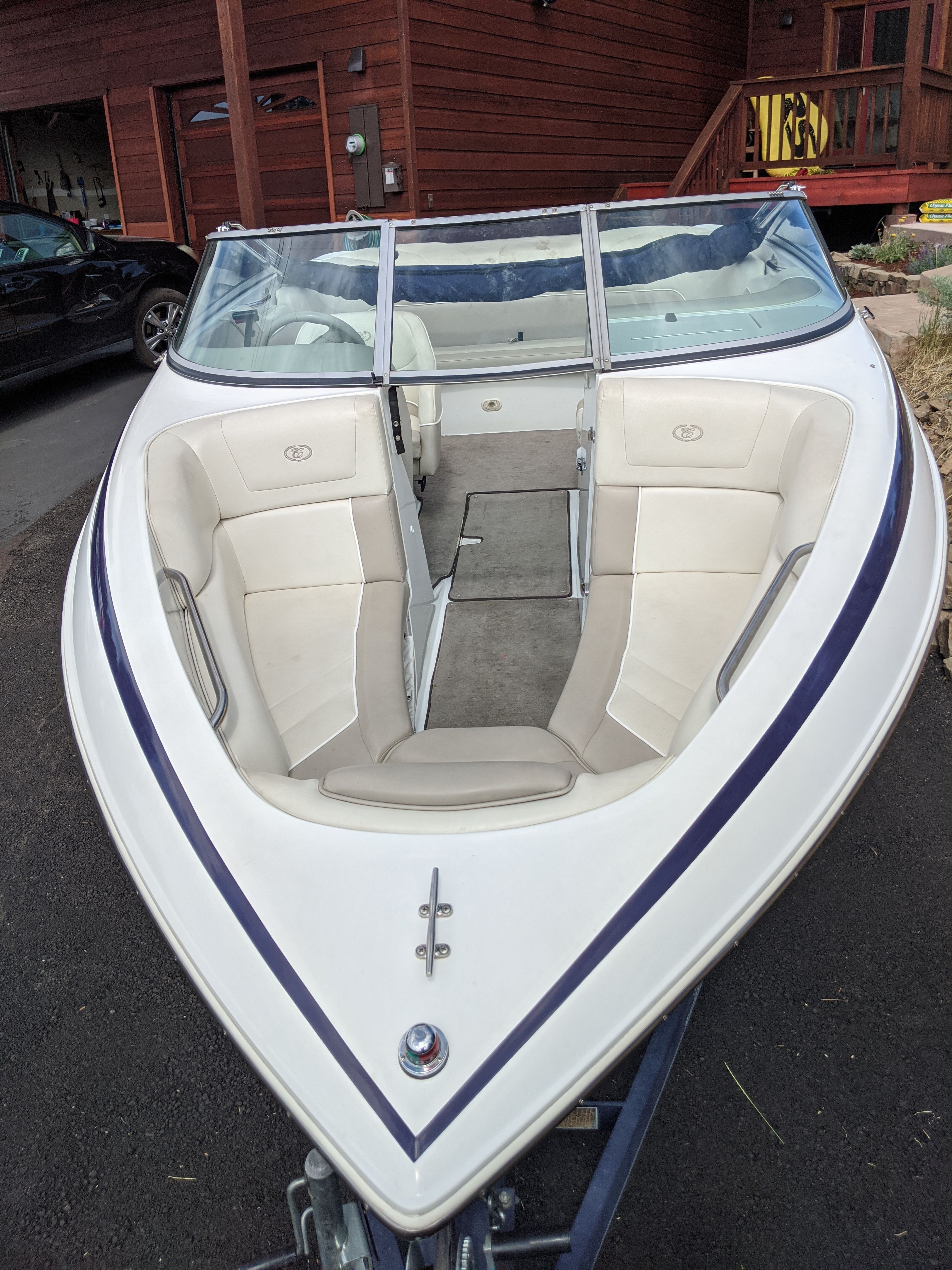A 1997 Cobalt 190 boat with beige interior and blue accents.