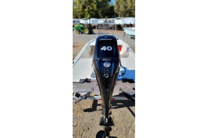 2026 Mako Pro Skiff 13 CC with Mercury 40 outboard motor, parked outdoors.