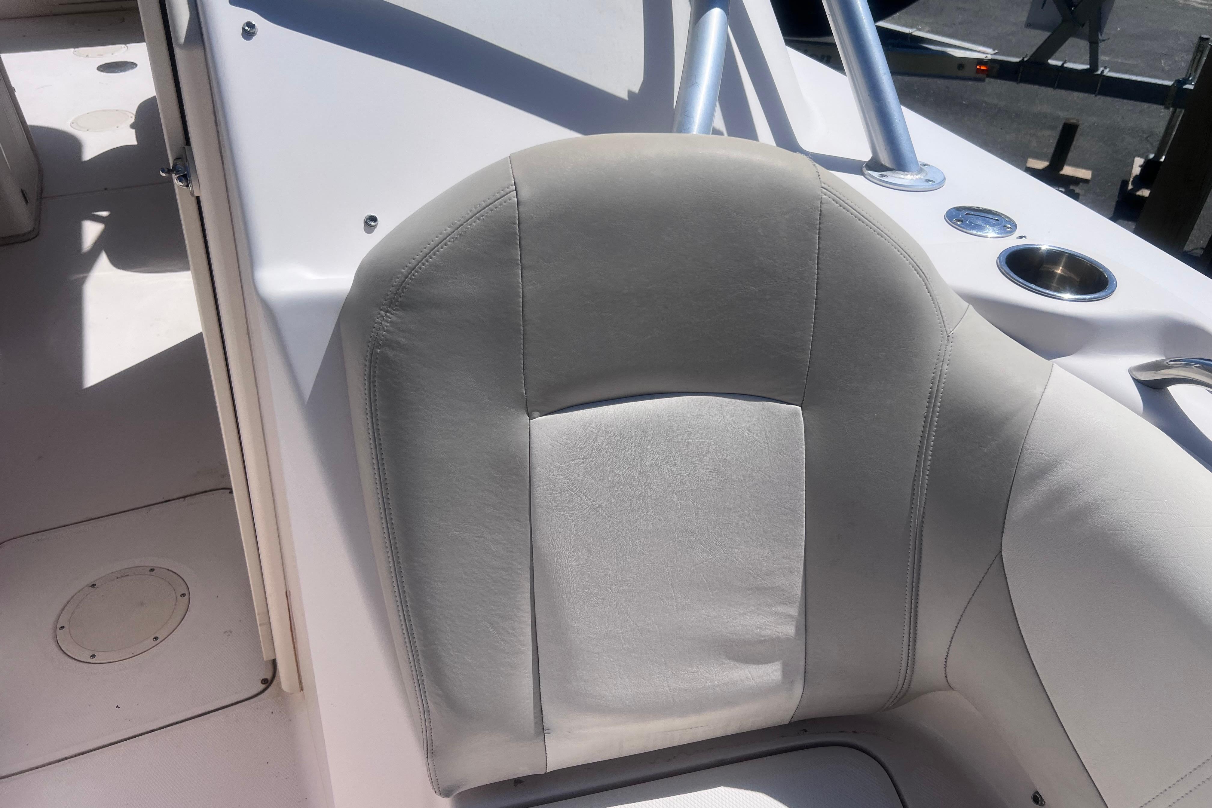 2012 Grady-White Freedom 275 boat seat with cup holder and railing.