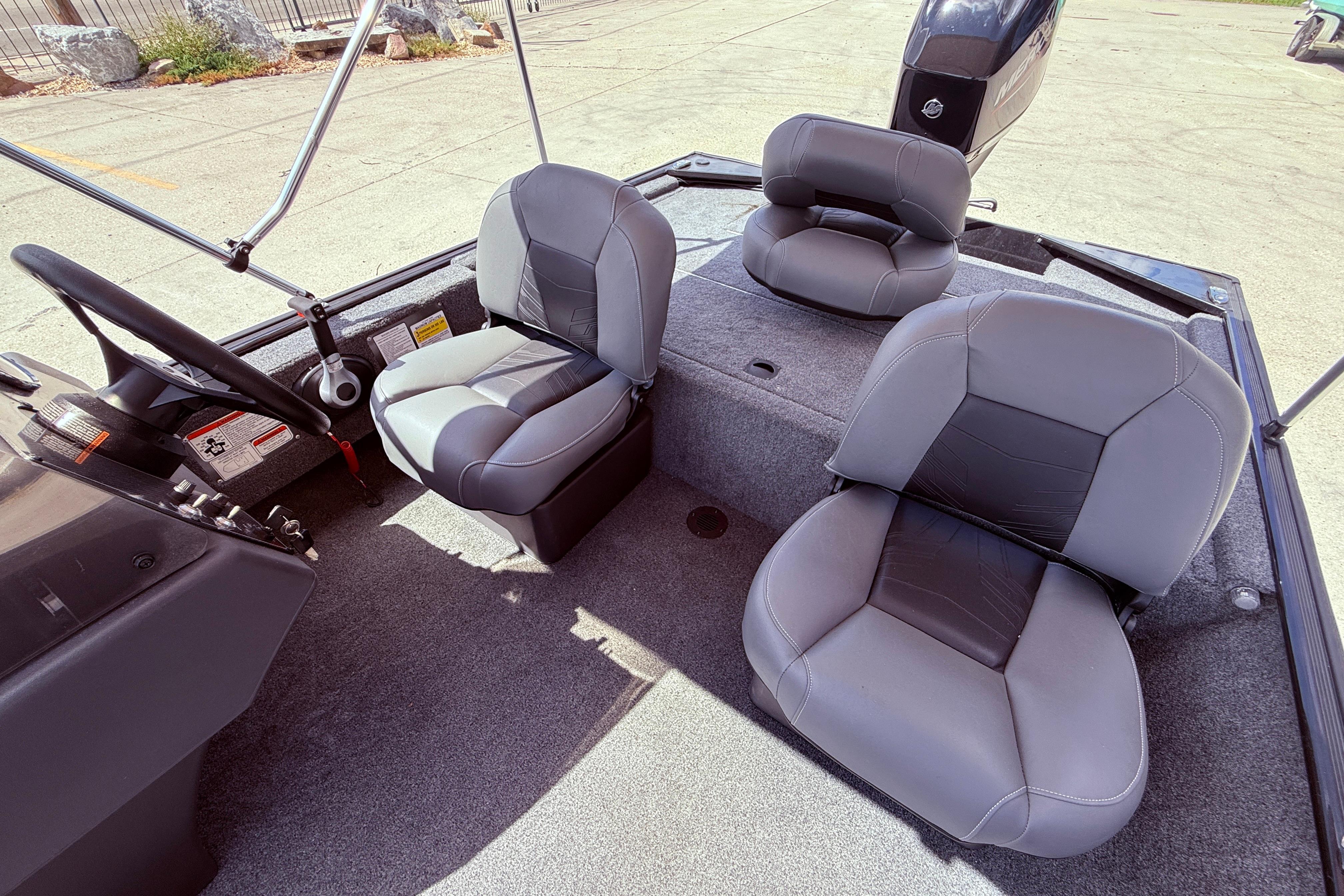 2025 Bass Tracker Classic XL boat interior with gray seating and steering wheel.