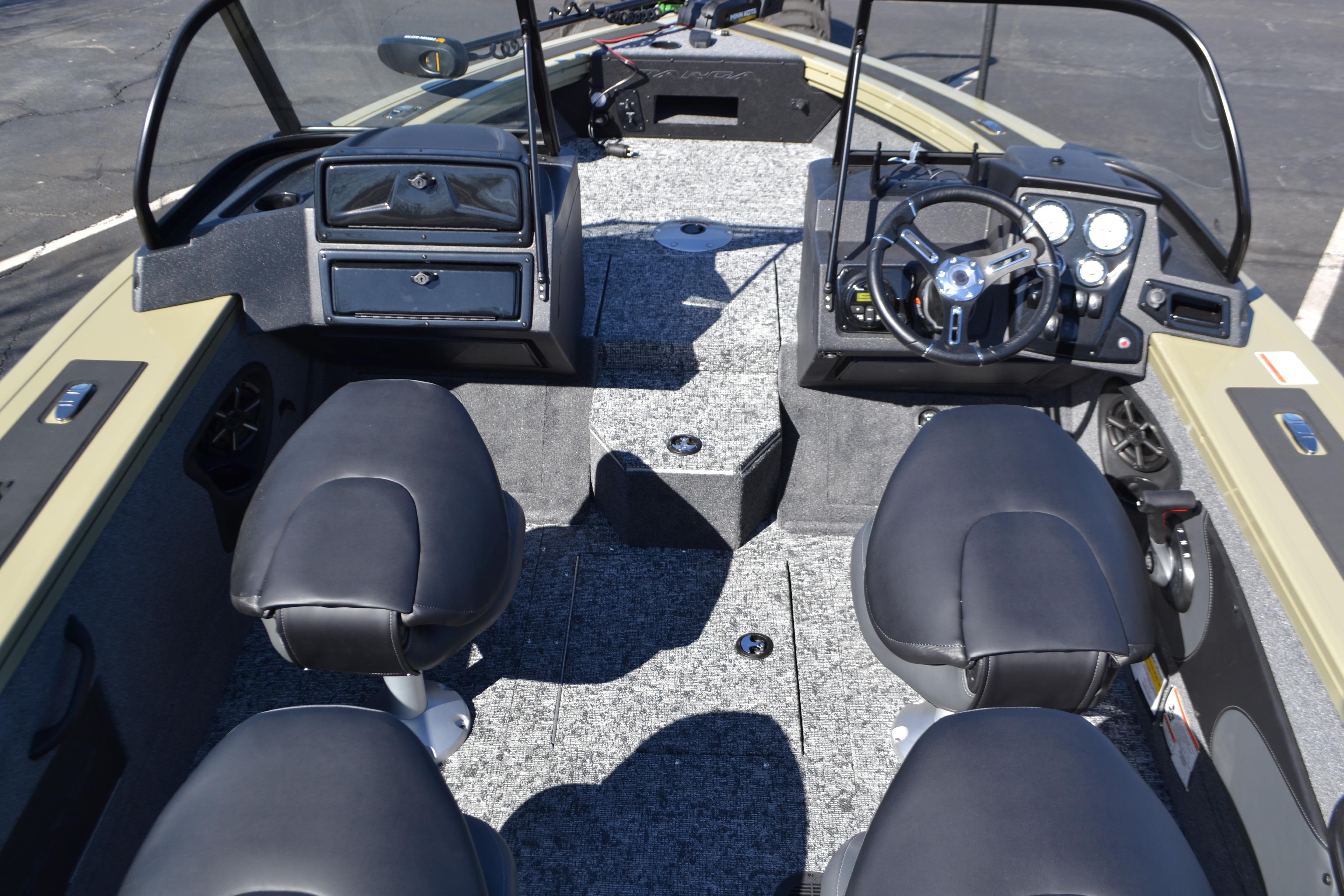 2026 Tracker Targa V-18 WT boat interior with four black seats and modern dashboard.