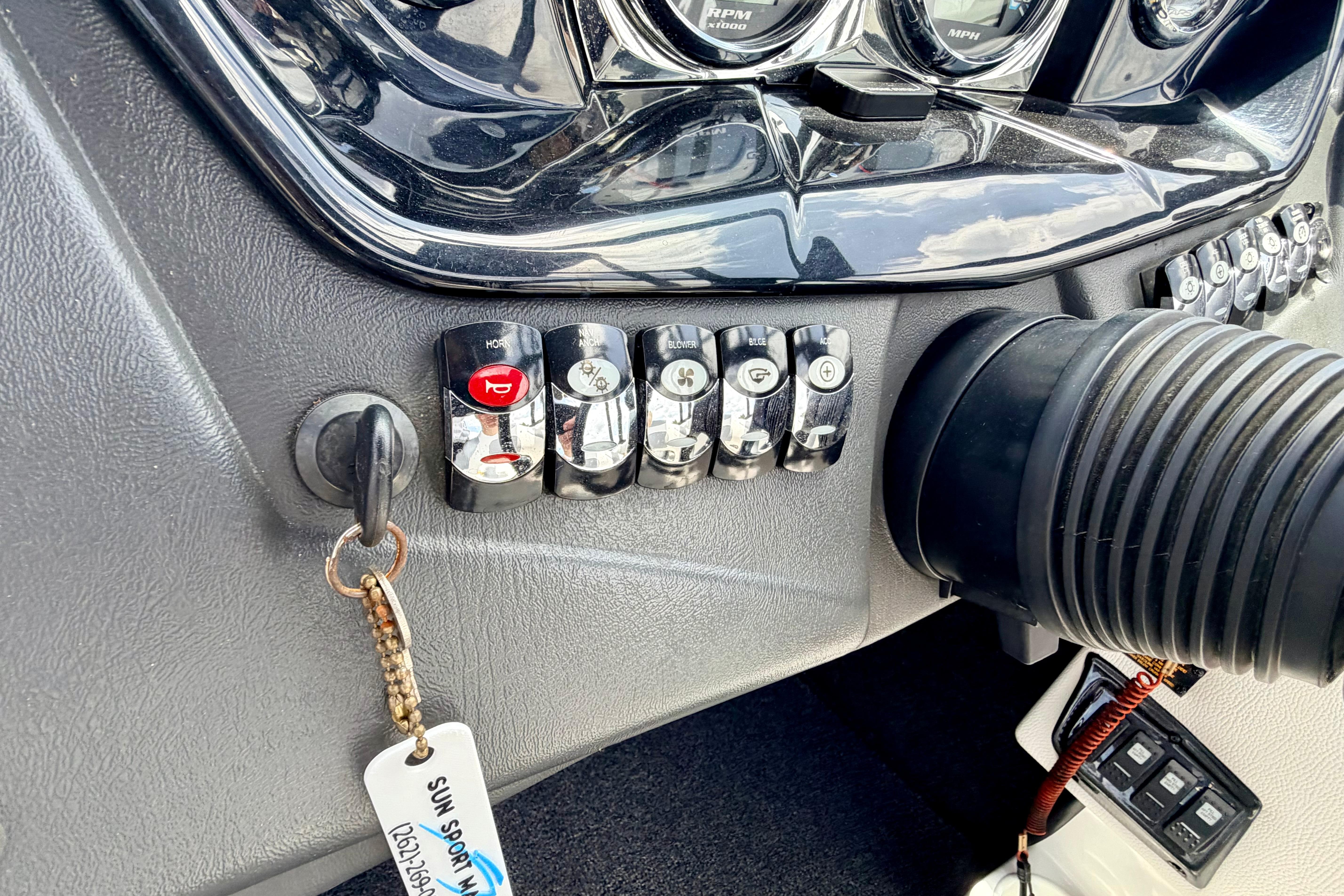 Dashboard controls of a 2014 Tigé R20 boat with key and switches.