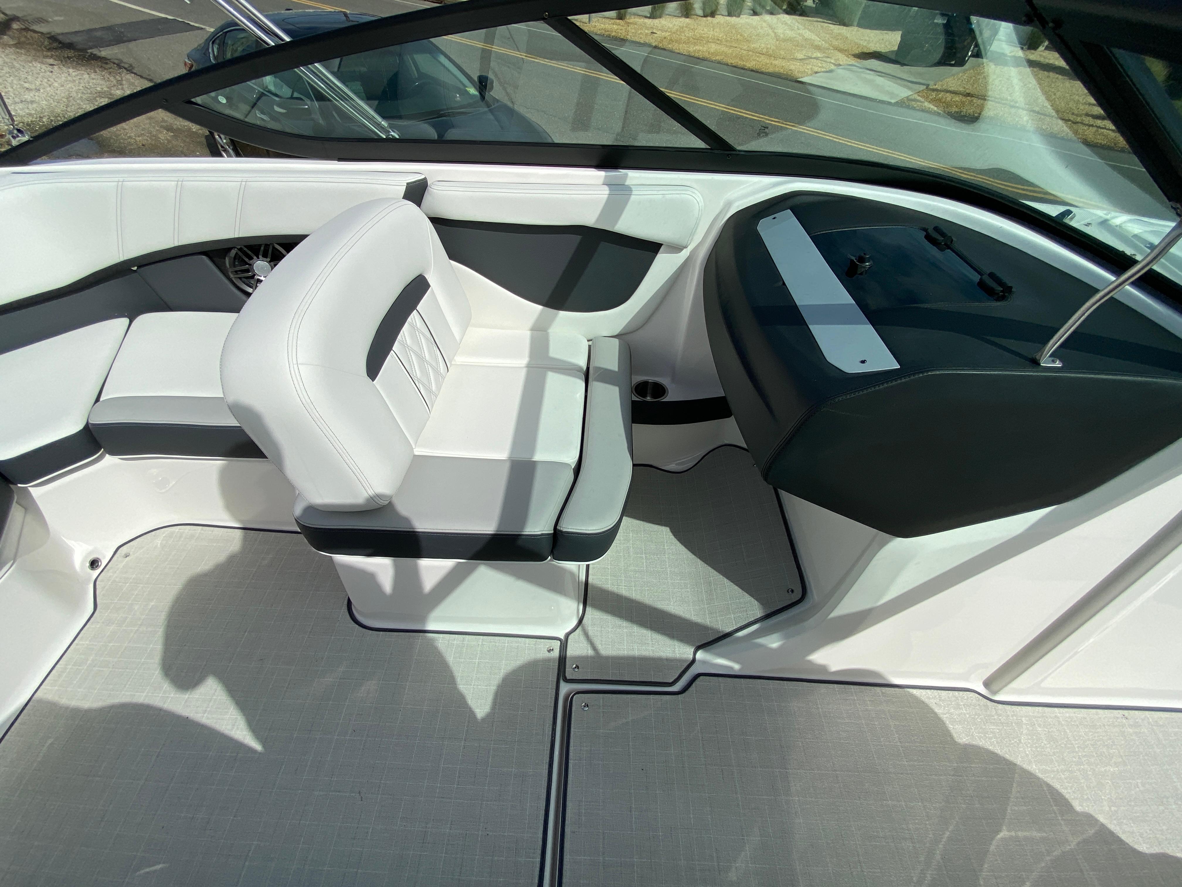 2026 Regal 21 OBX boat interior with white seating and modern dashboard design.