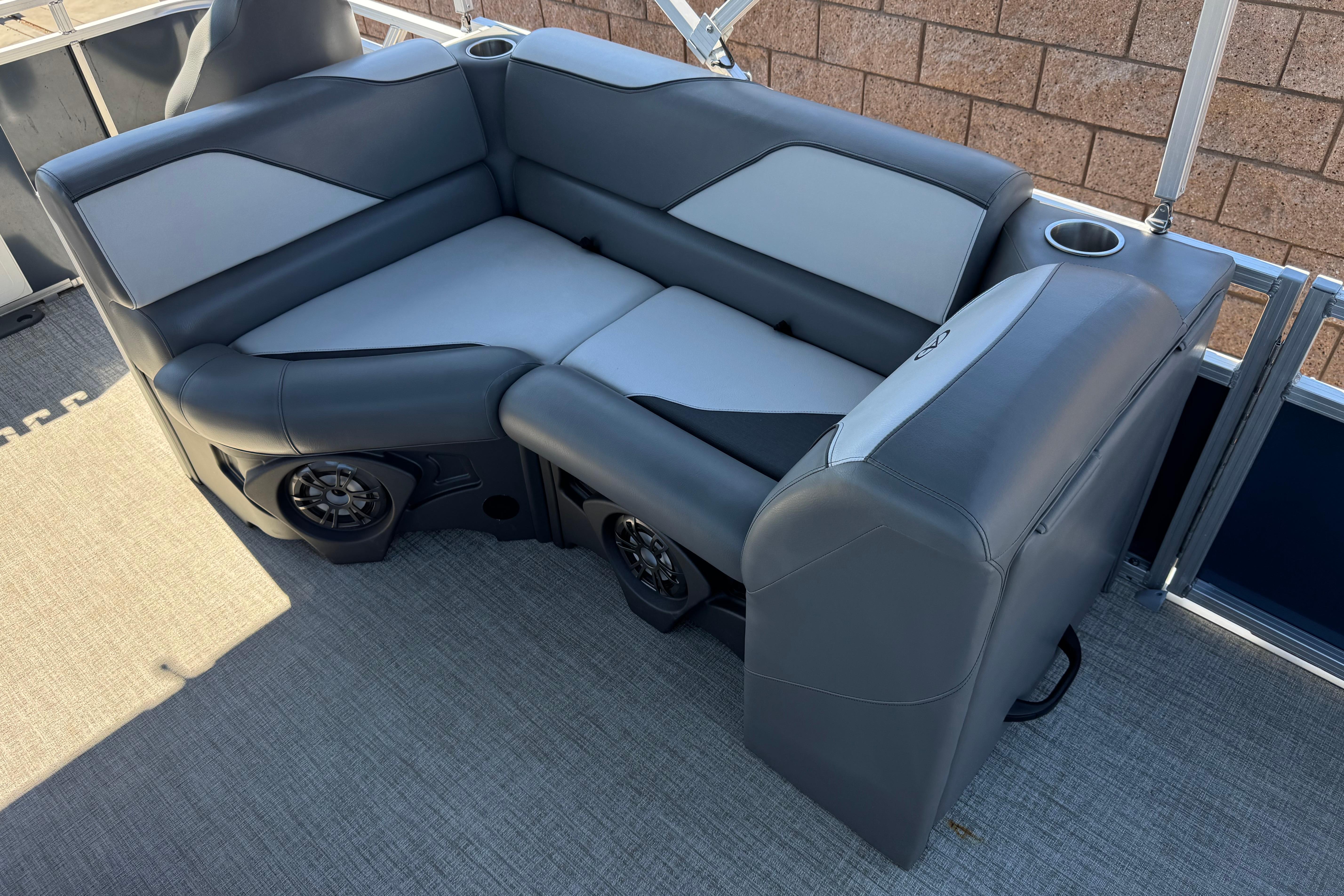 2023 Avalon Venture Fish N Cruise 20' boat seating with cup holders and speakers.
