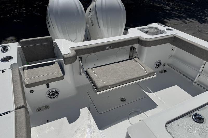 2026 Sea Hunt Gamefish 30 Forward Seating boat interior with dual engines and seating area.