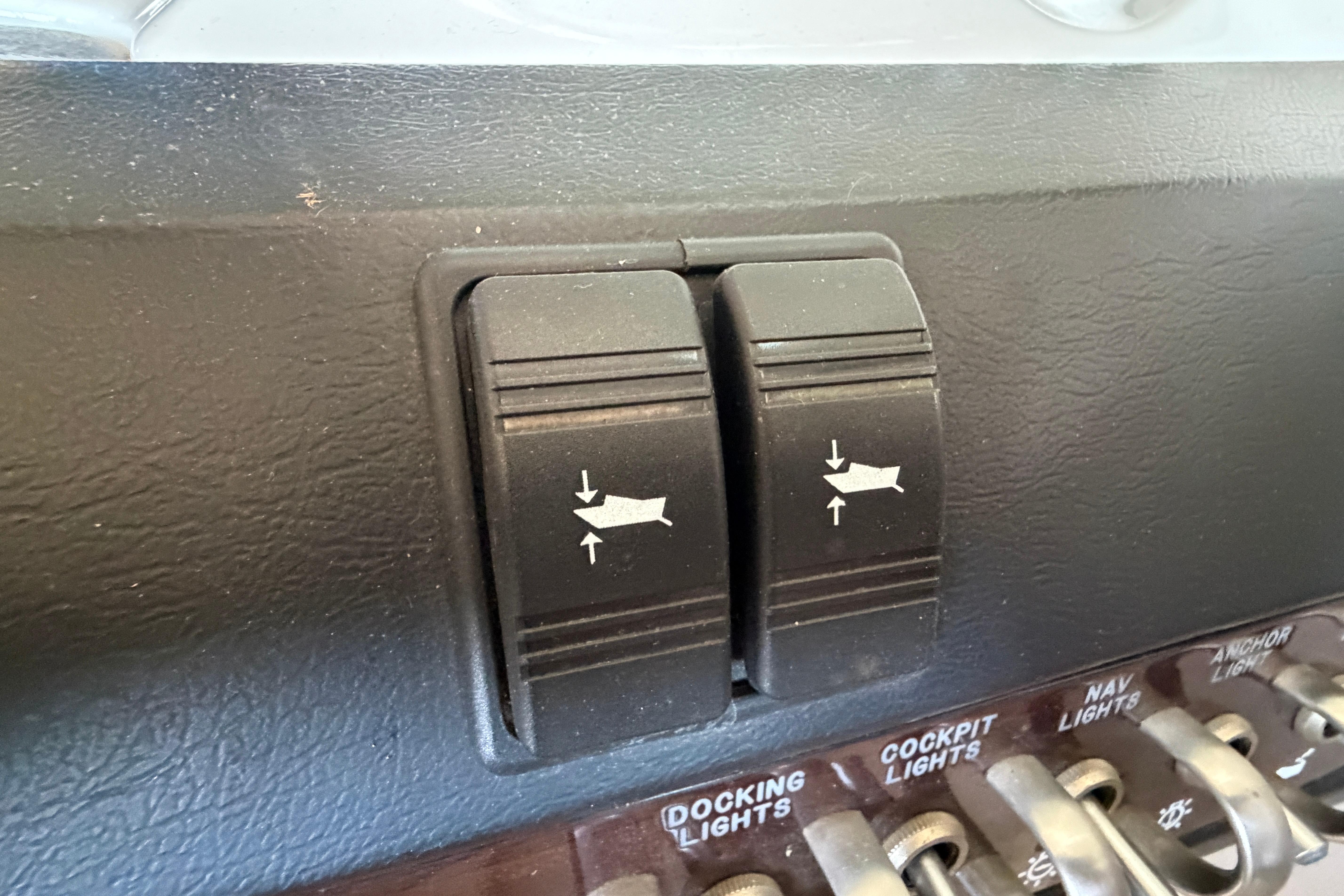 Dashboard switches on a 2007 Sea Ray 270 SLX boat, featuring docking and cockpit lights.
