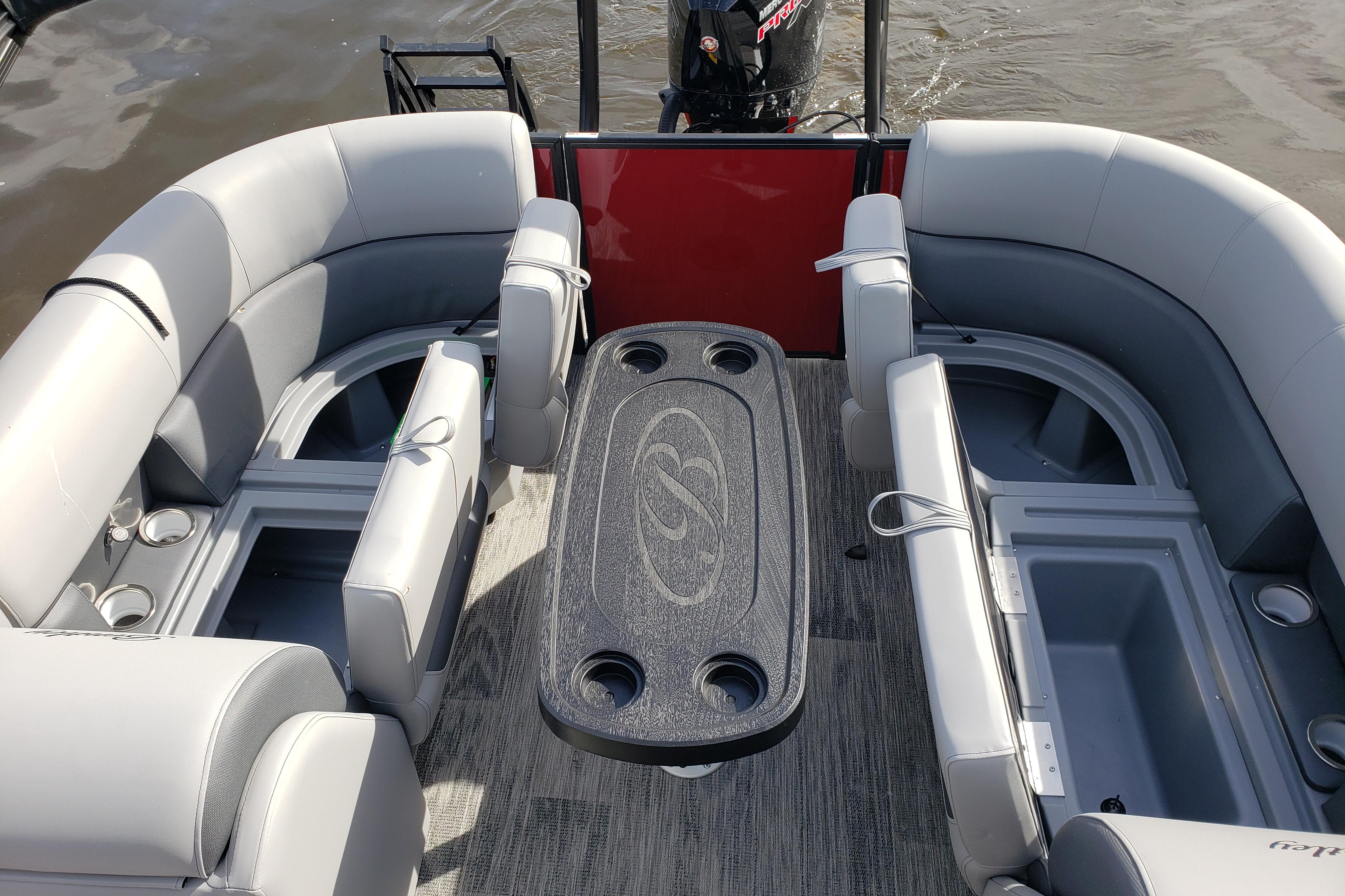 Interior of 2026 Bentley Pontoons Legacy 243 Navigator Ext with seating and table.