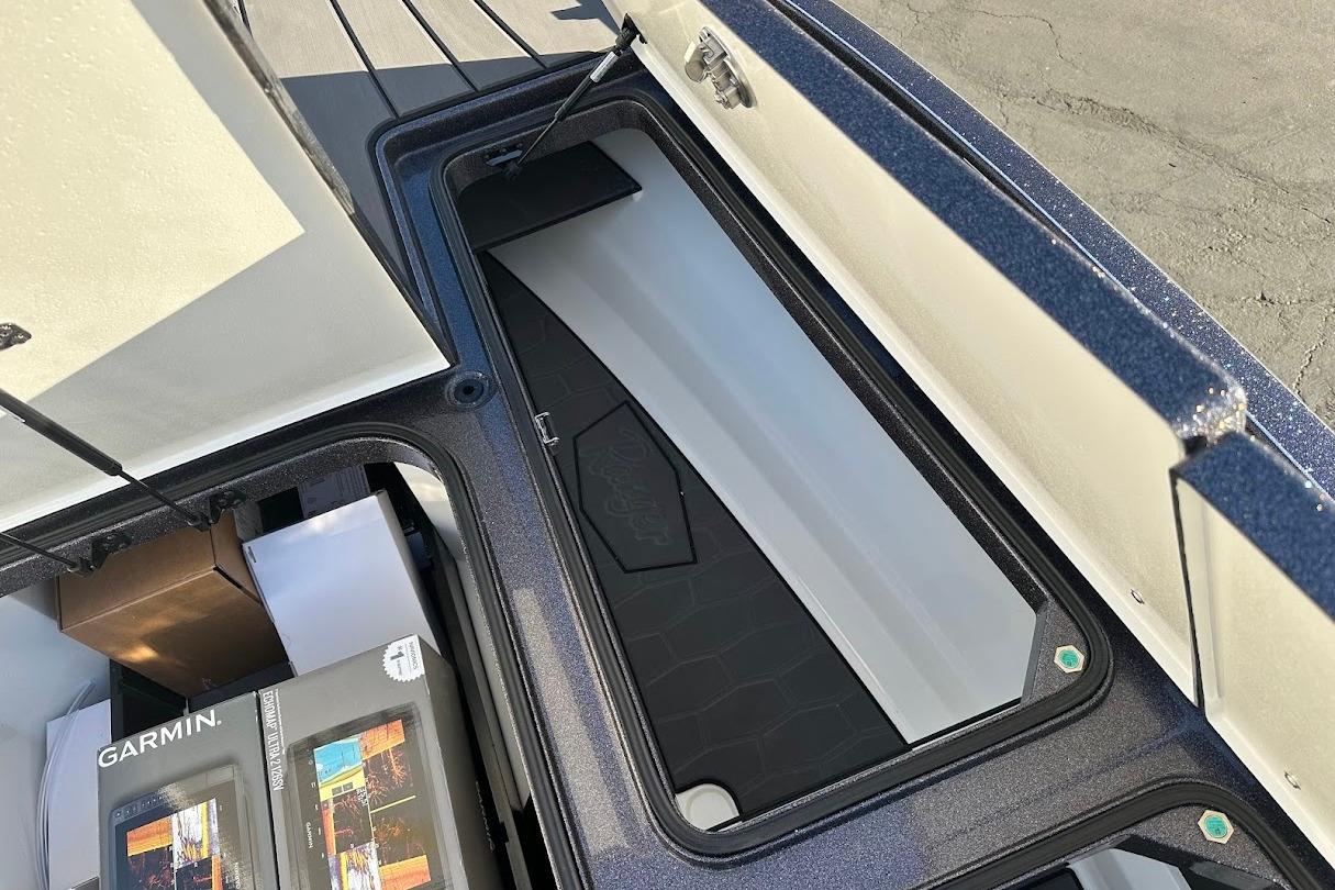 2026 Ranger Z521R Garmin Cup-Equipped boat storage compartment with Garmin electronics boxes.
