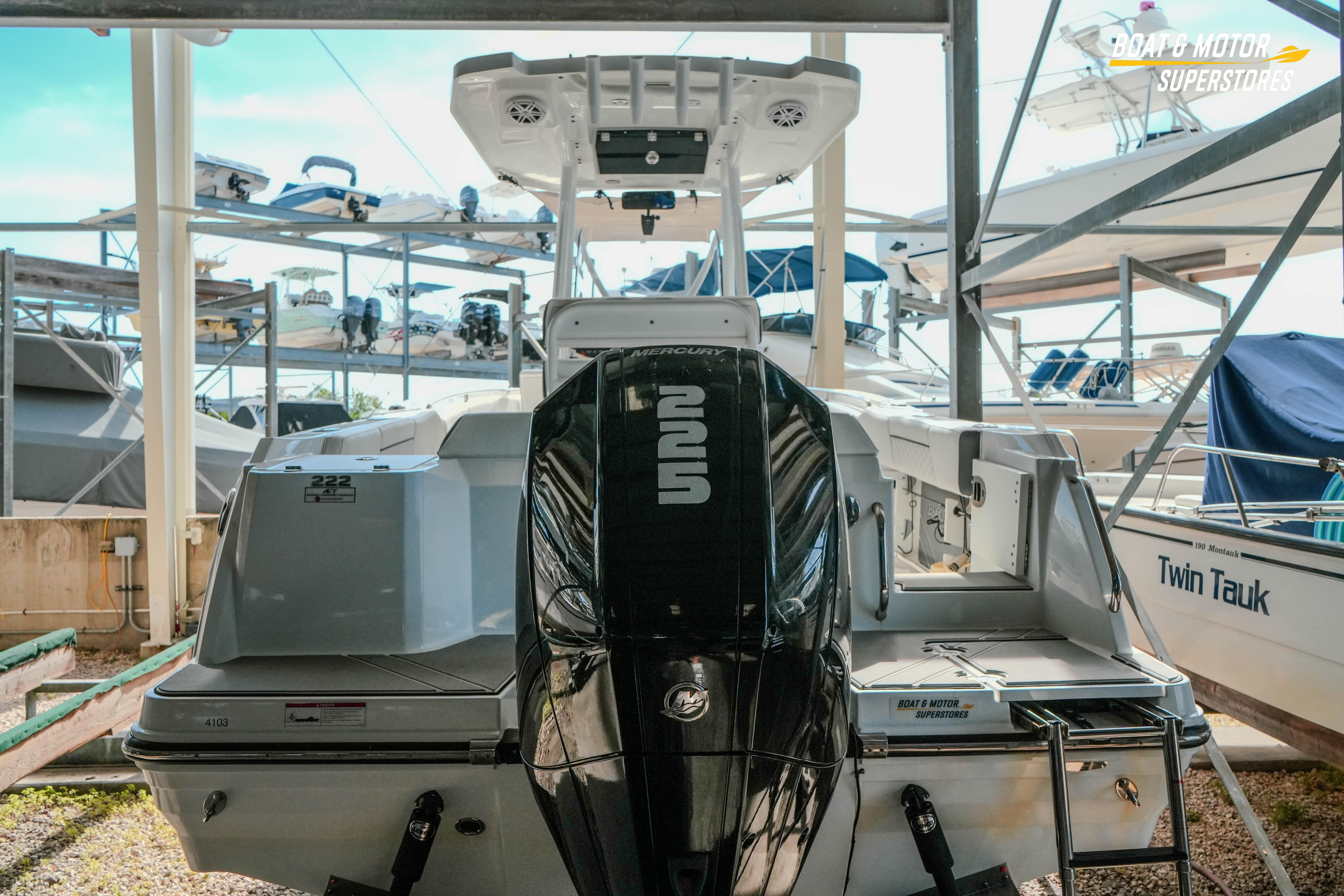 2022 Blackfin 222 CC boat with Mercury engine in storage facility.