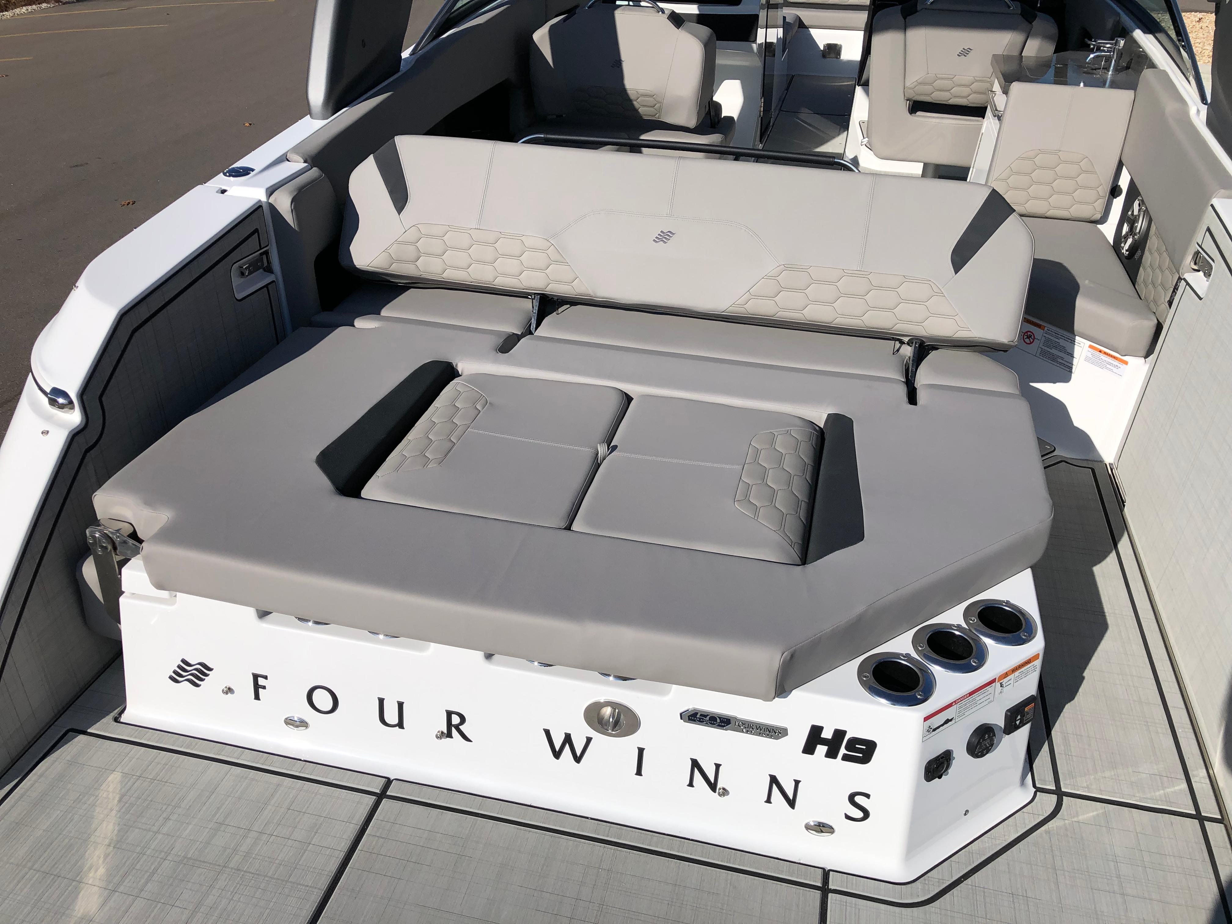 2025 Four Winns H9 boat interior with luxurious seating and modern design.