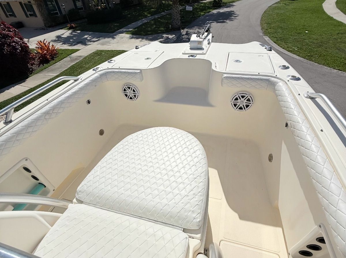 Interior of a 2004 World Cat 270TE boat with white upholstery.