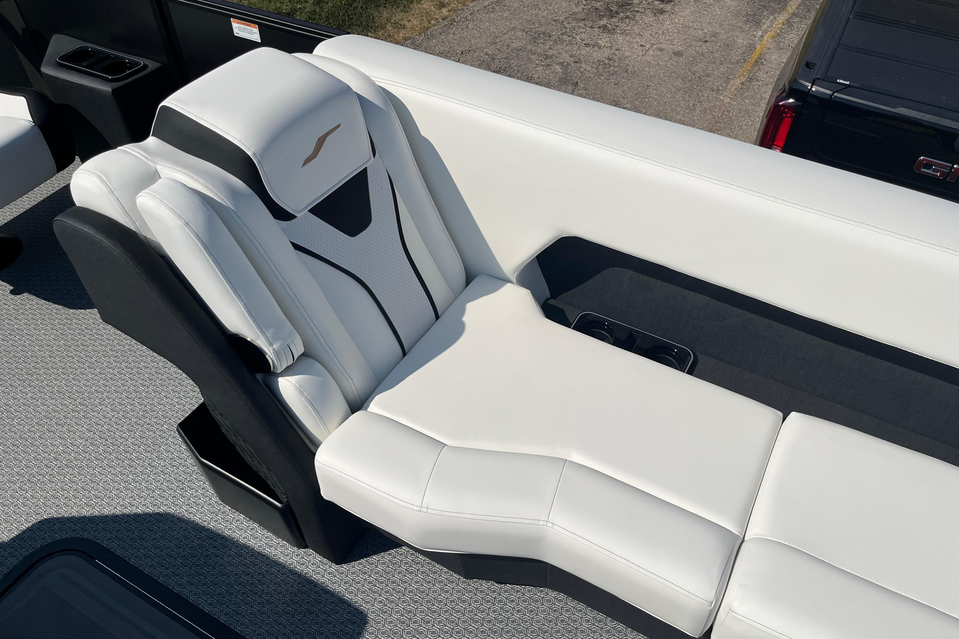 Luxurious white seating on 2026 Evotti 725CS boat, featuring modern design and comfort.