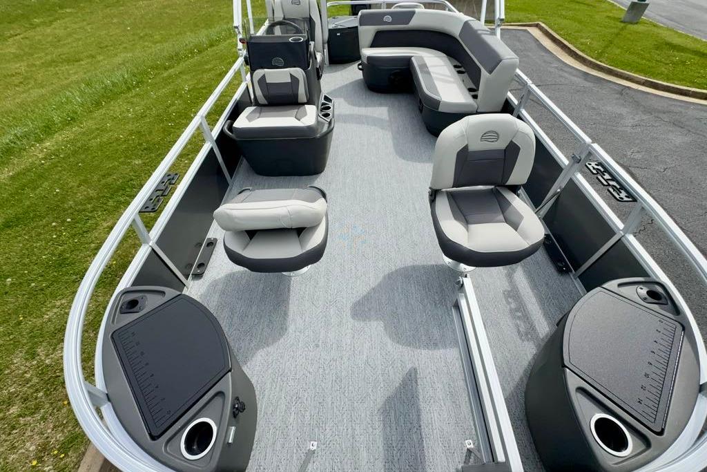 2026 Sun Tracker Bass Buggy 18 DLX pontoon boat interior with seating and storage compartments.