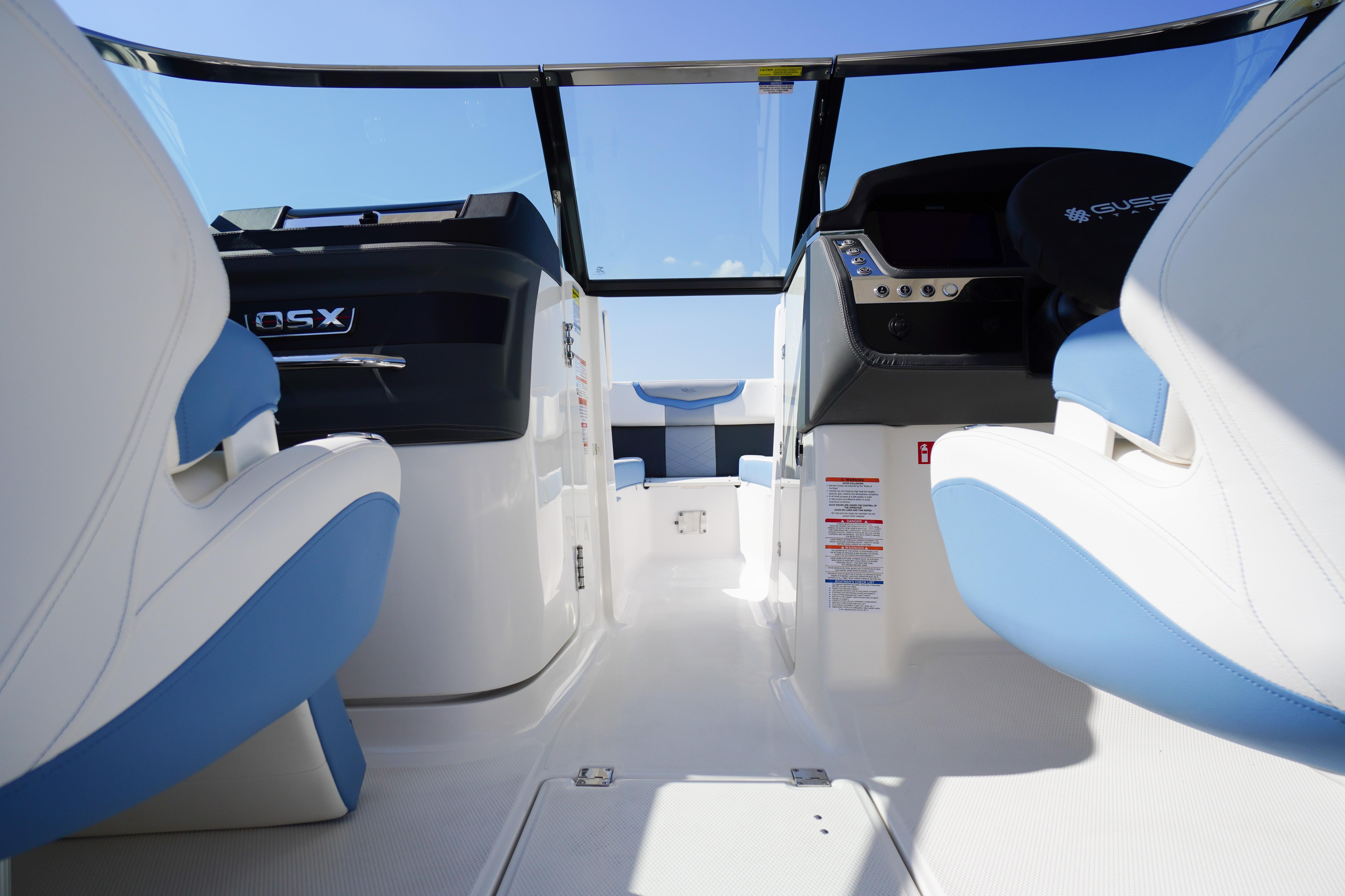 2026 Chaparral 270 OSX boat interior with modern seating and sleek dashboard design.