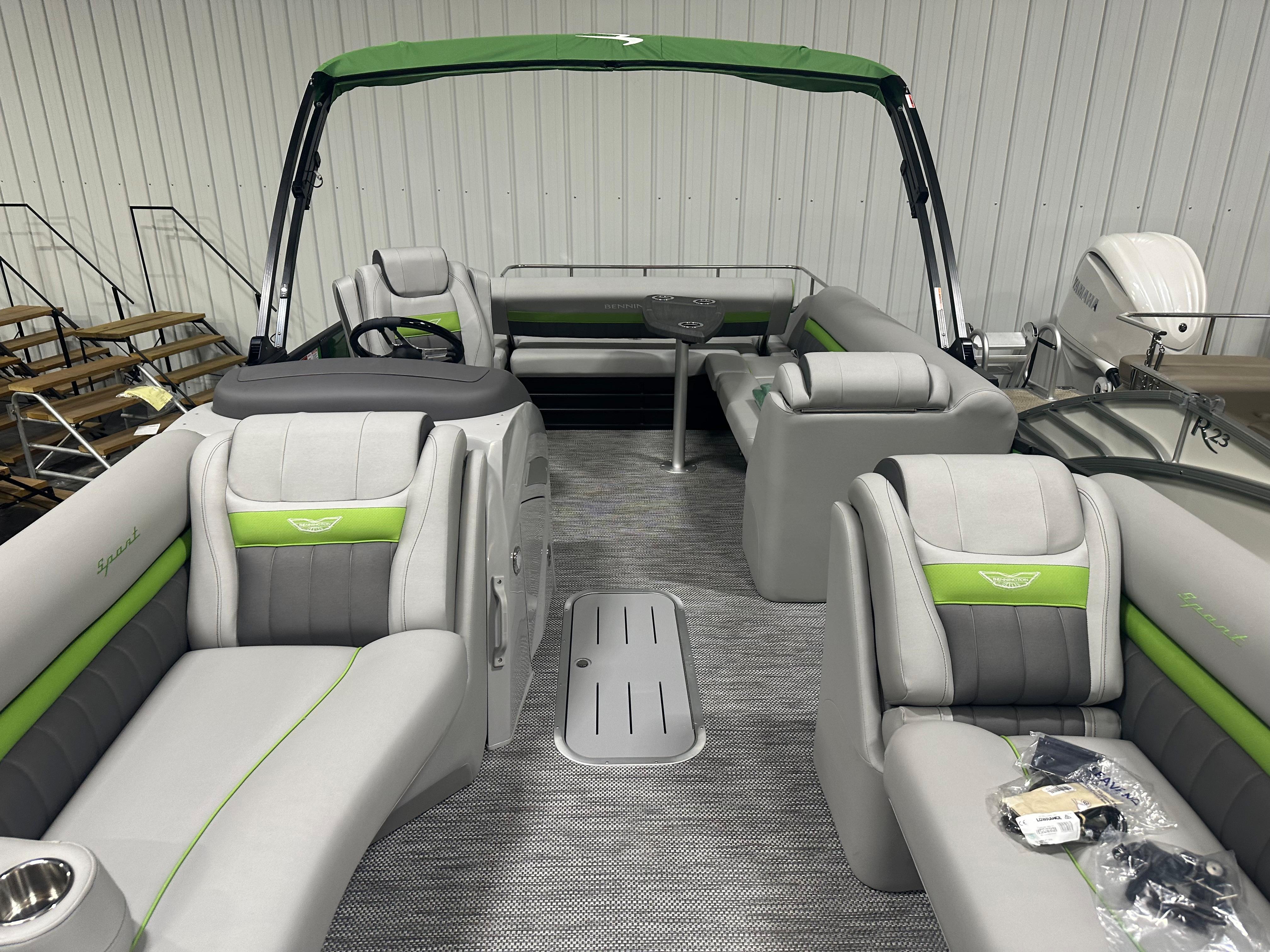 2024 Bennington 24LXS pontoon boat with green and gray interior.