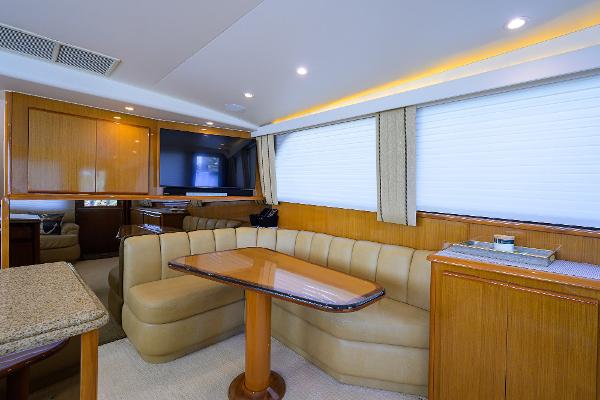 Luxurious interior of 2000 Viking 50 Convertible yacht with elegant seating and dining area.