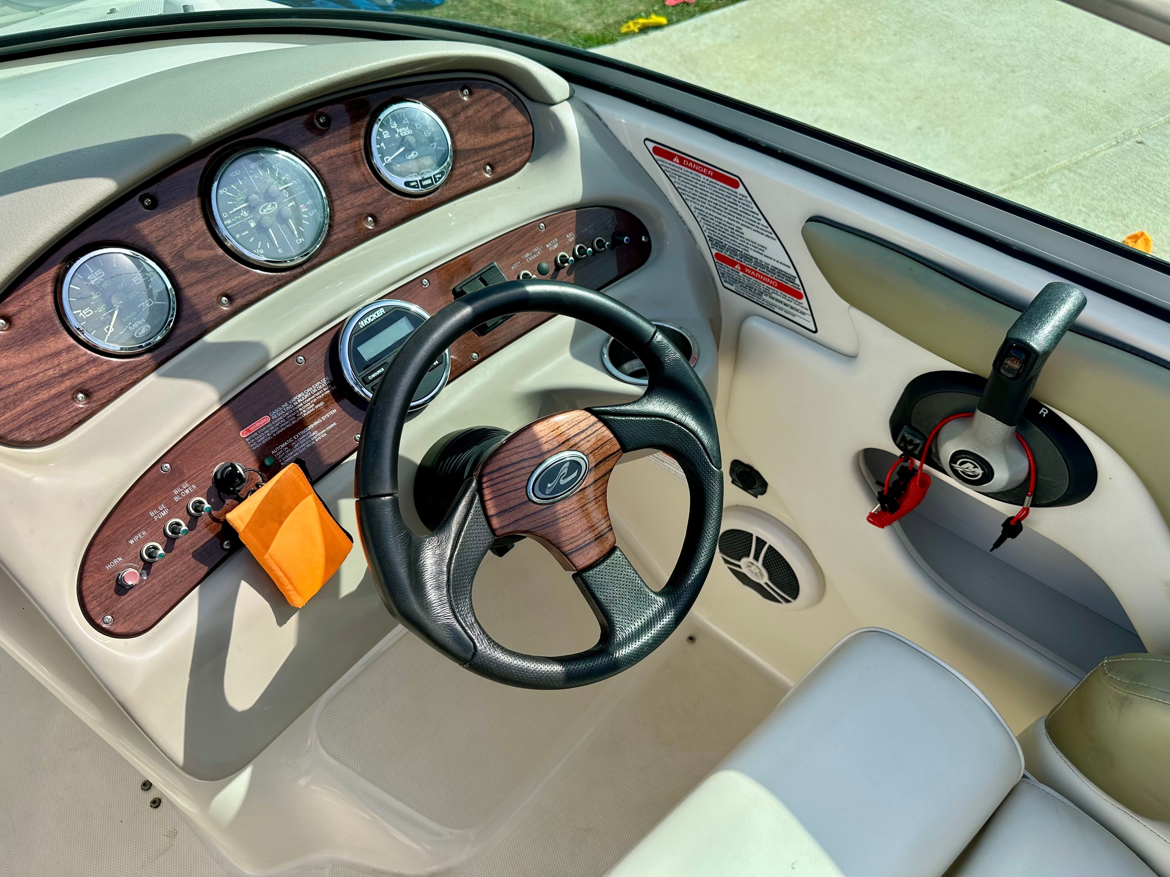 Interior view of 2006 Sea Ray 240 Sundeck dashboard.