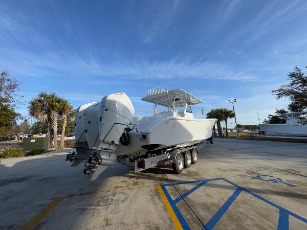 2025 Yellowfin 39 Offshore boat on trailer, parked outdoors under clear blue sky.