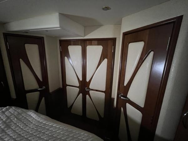 Interior of 2009 Ovation 52 yacht with stylish wooden doors.