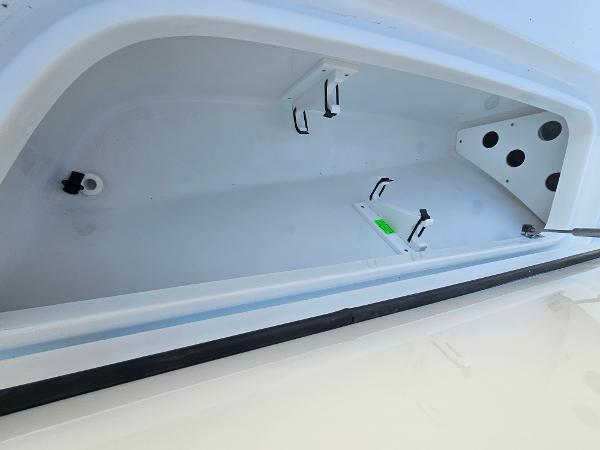 Storage compartment of 2026 Sea Hunt BX 22 BR boat, featuring secure latches and spacious interior.