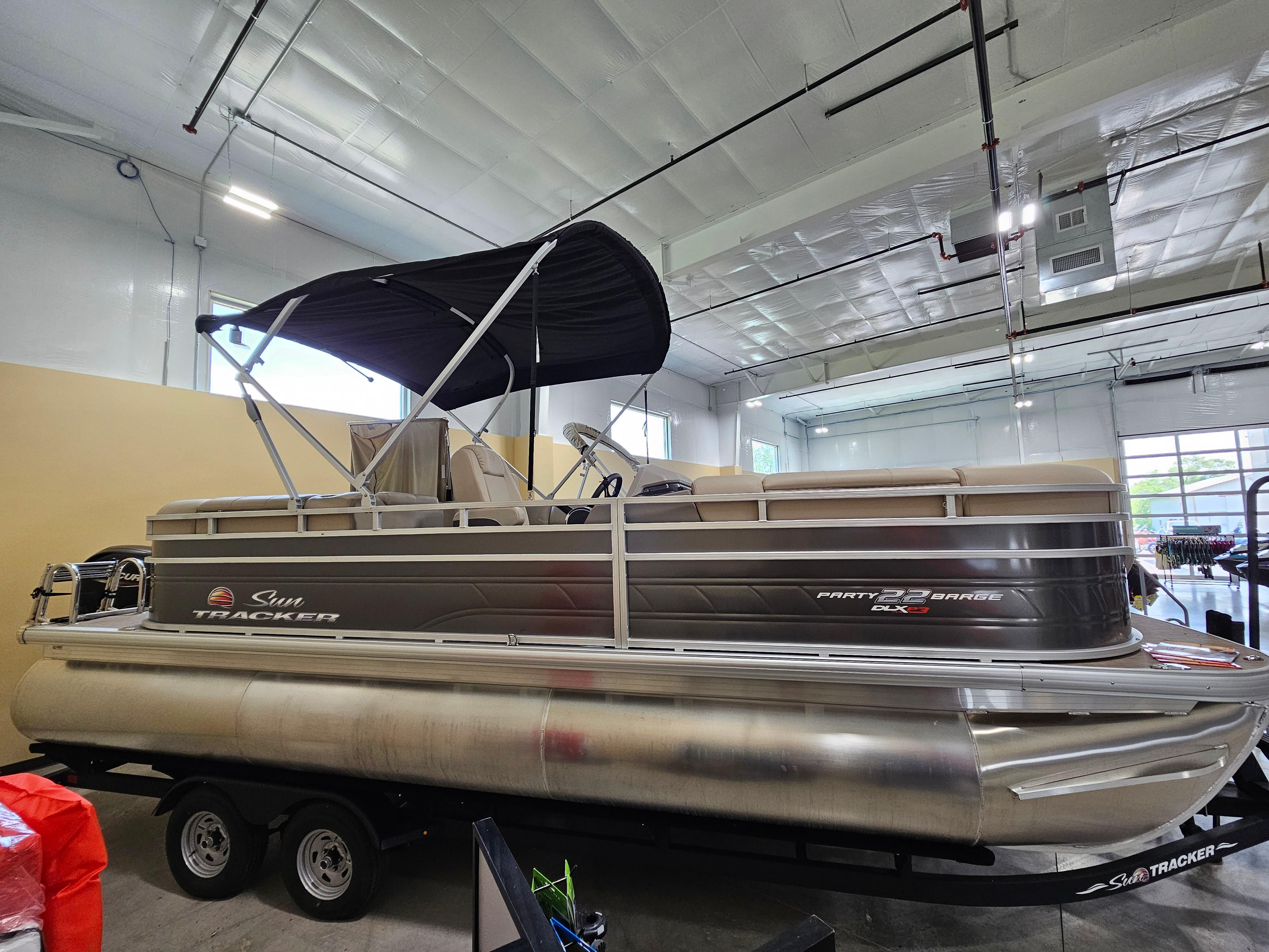 2024 Sun Tracker Party Barge 22 RF XP3 pontoon boat in showroom.
