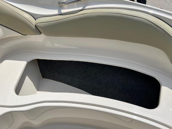 2005 Sea Ray 220 Sundeck boat interior storage compartment with cushioned seating.
