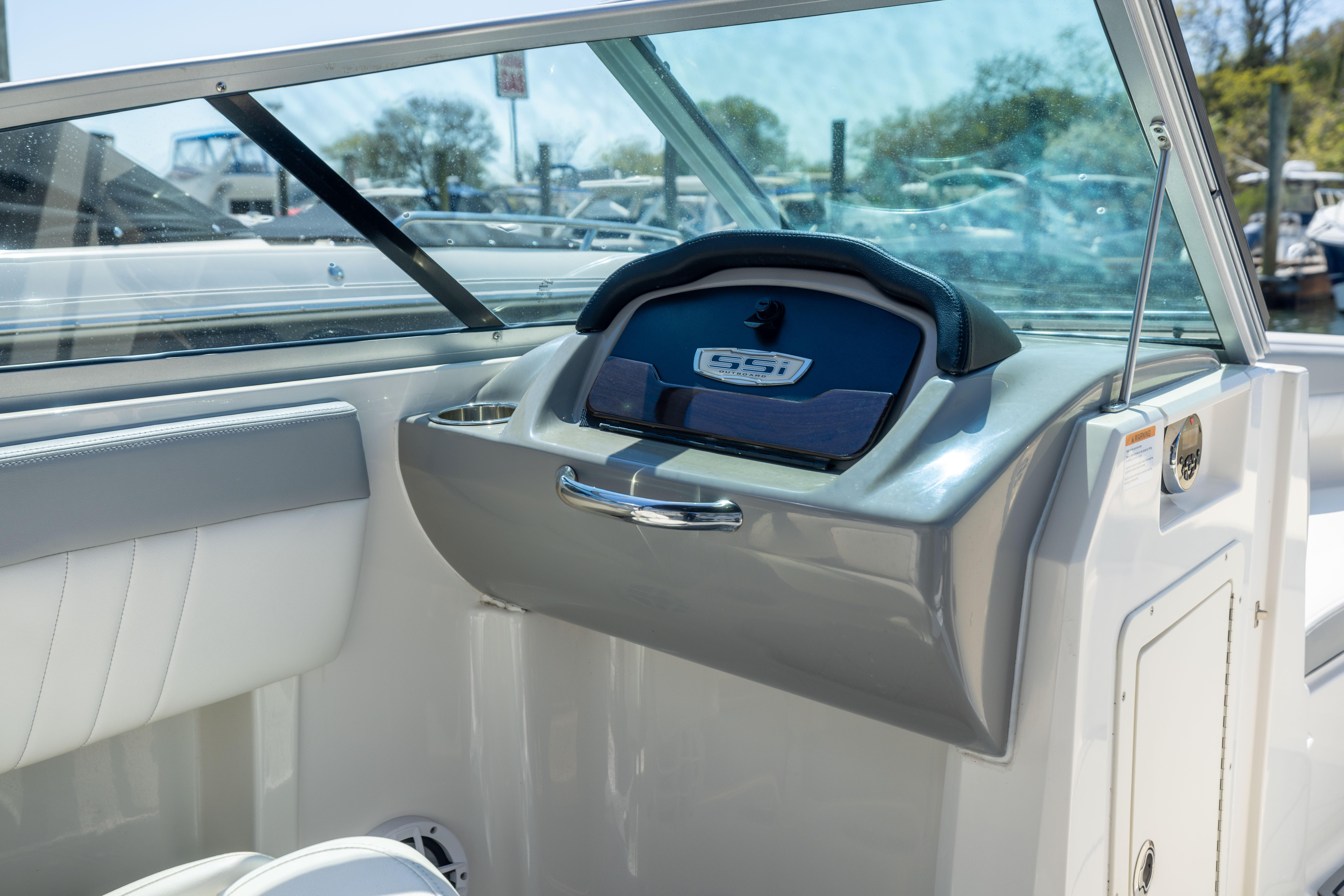 2022 Chaparral 21 SSi OB boat interior with sleek dashboard and windshield.