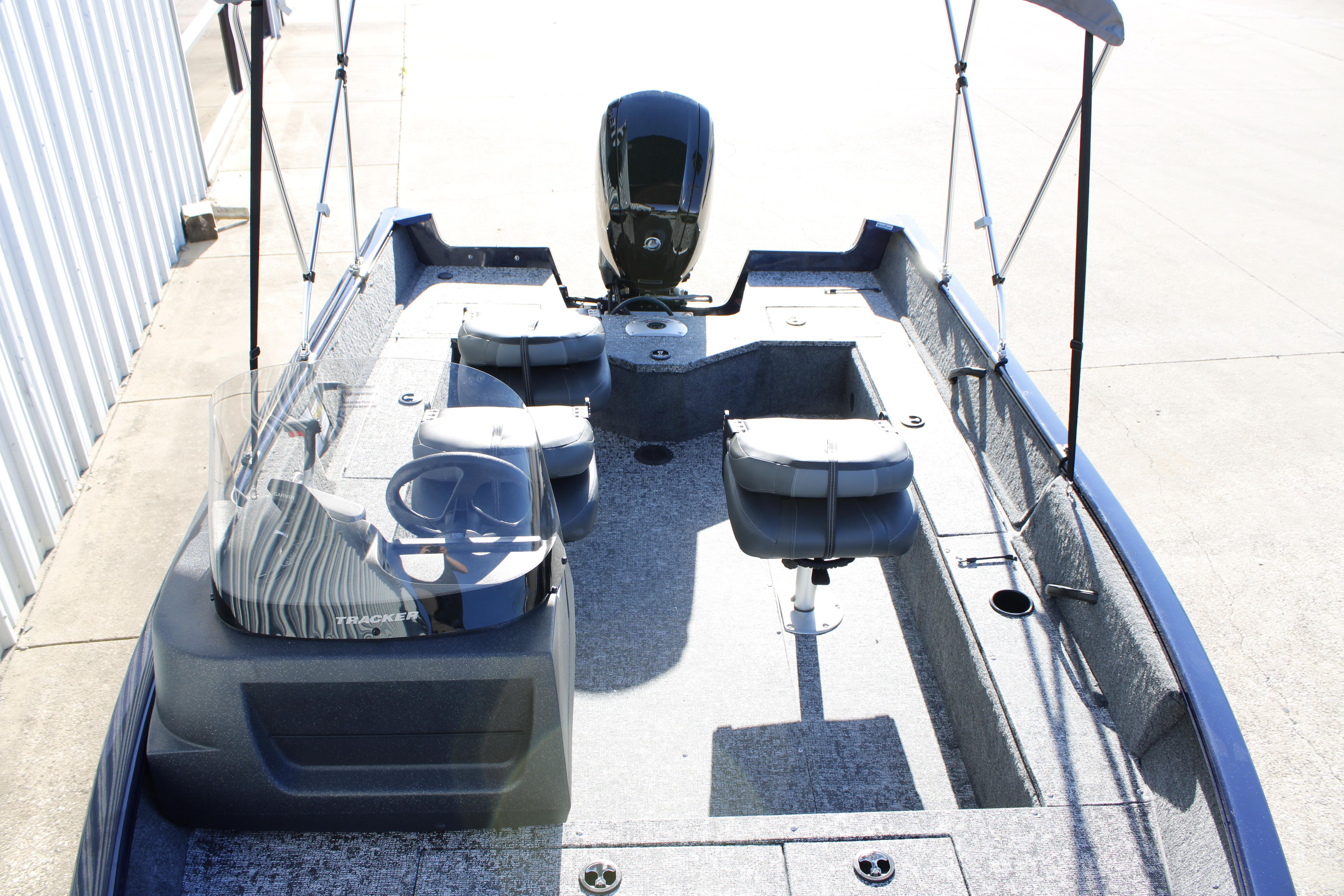 2026 Tracker Pro Guide V-16 SC boat interior with seating and steering wheel.